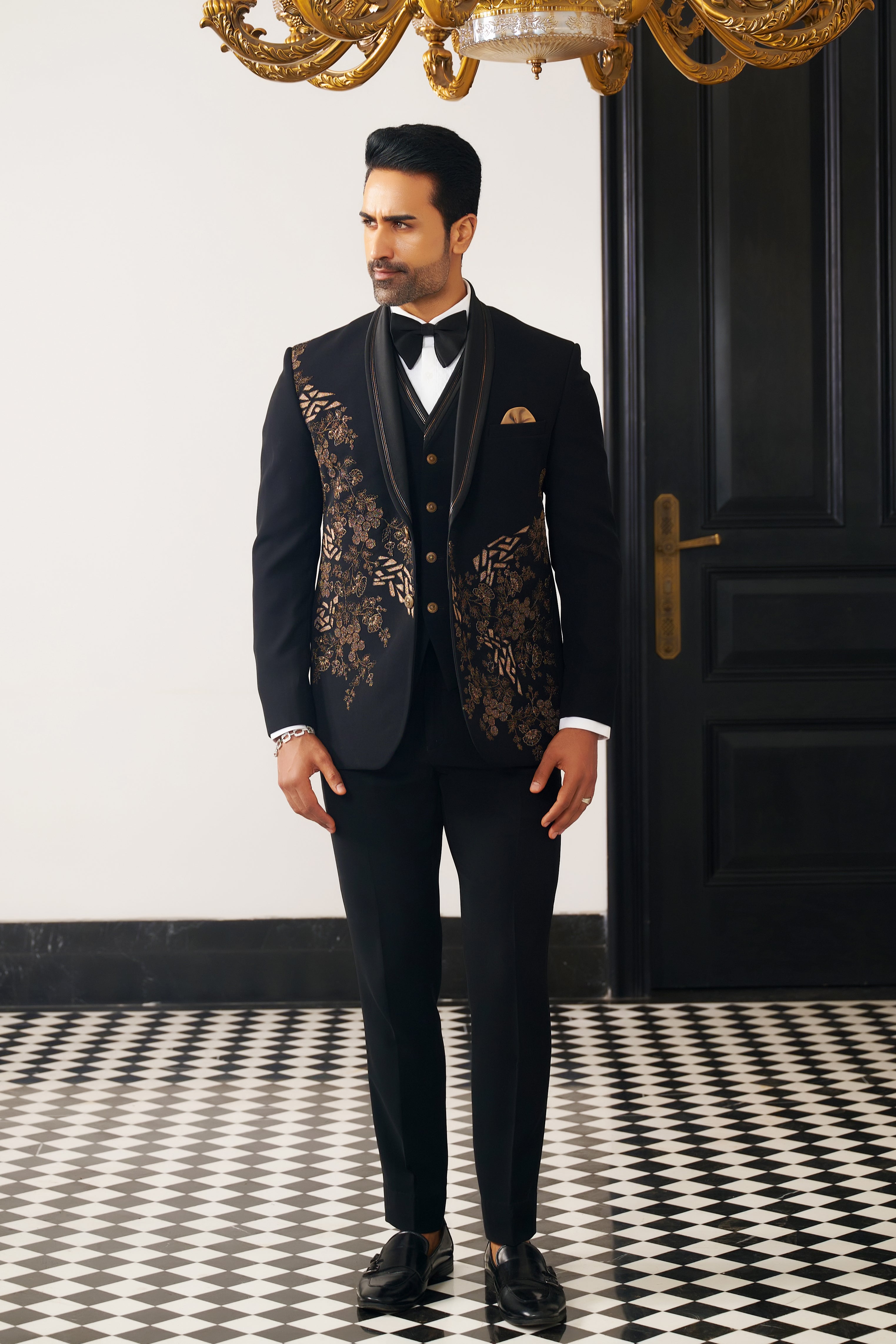 A bold black party wear suit, make a statement.
A timeless black party wear suit