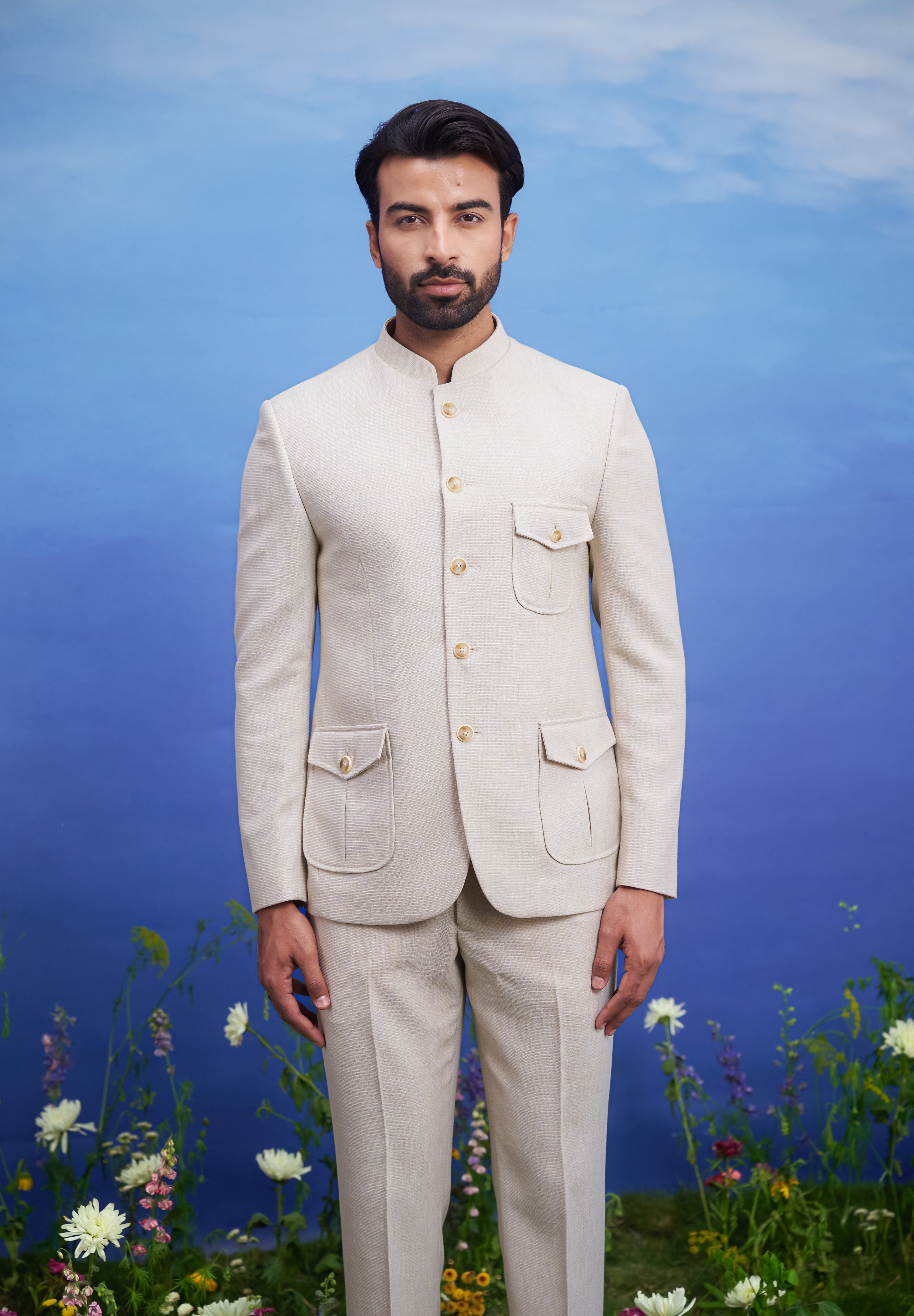 Men's cream Bandhgala attire with patch pockets, suitable for weddings and festivals, available in sizes 36 to 44 and custom.