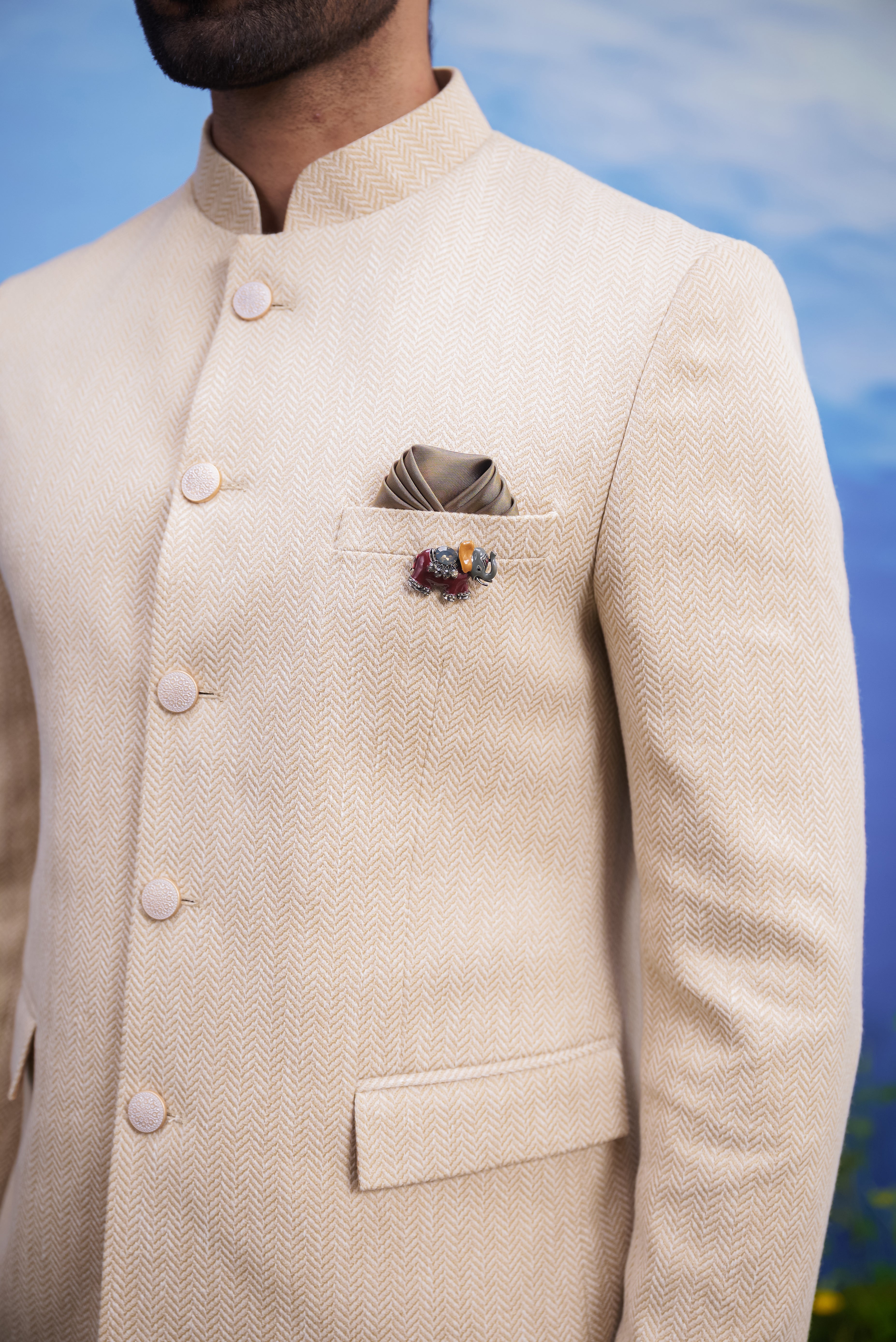 Close-up of the beige Herringbone structured Bandhgala suit, highlighting the structured tailoring and herringbone fabric texture.
