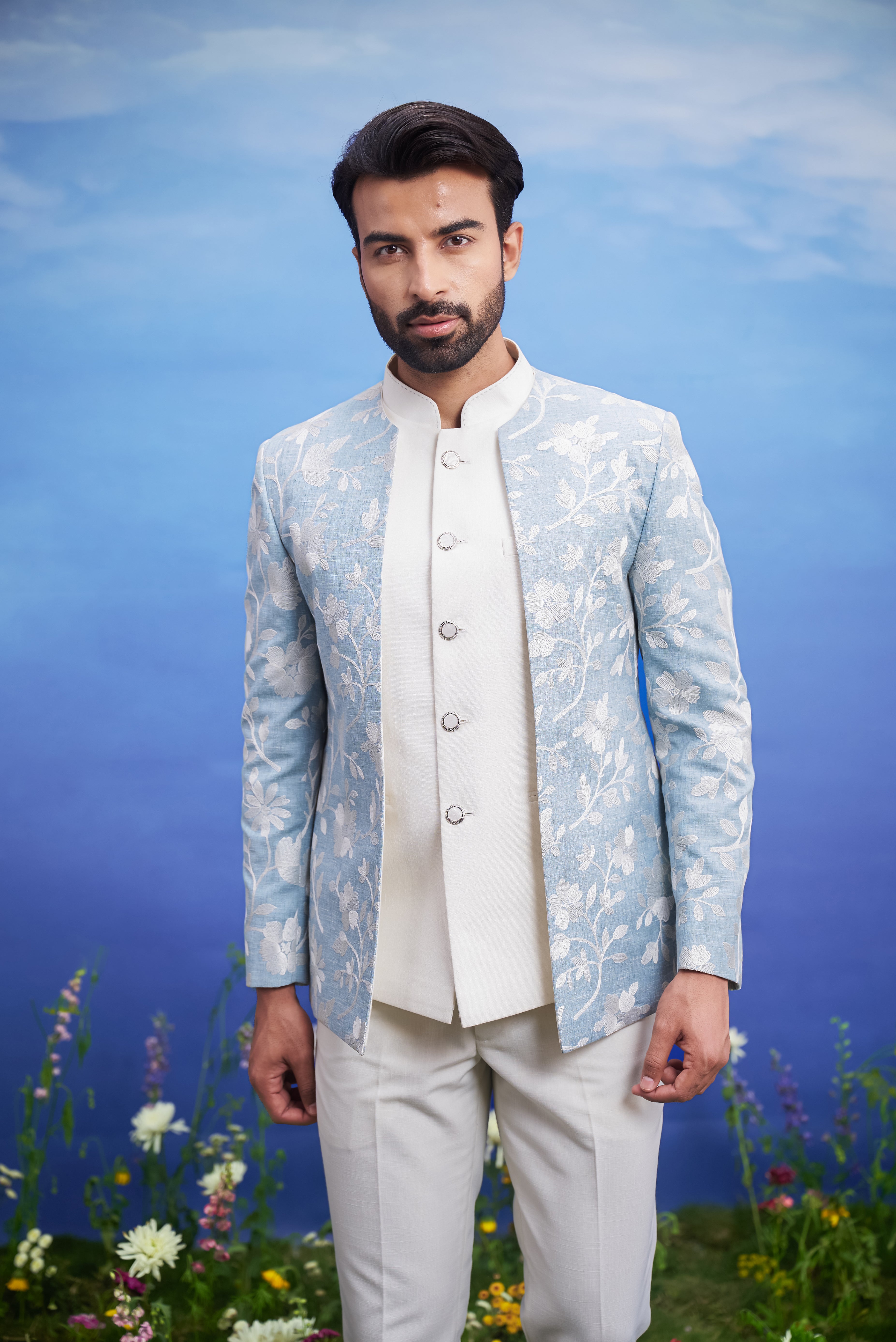 Men's light blue Bandhgala attire, suitable for weddings and festivals, featuring linen fabric, available in sizes 36 to 44 and custom.