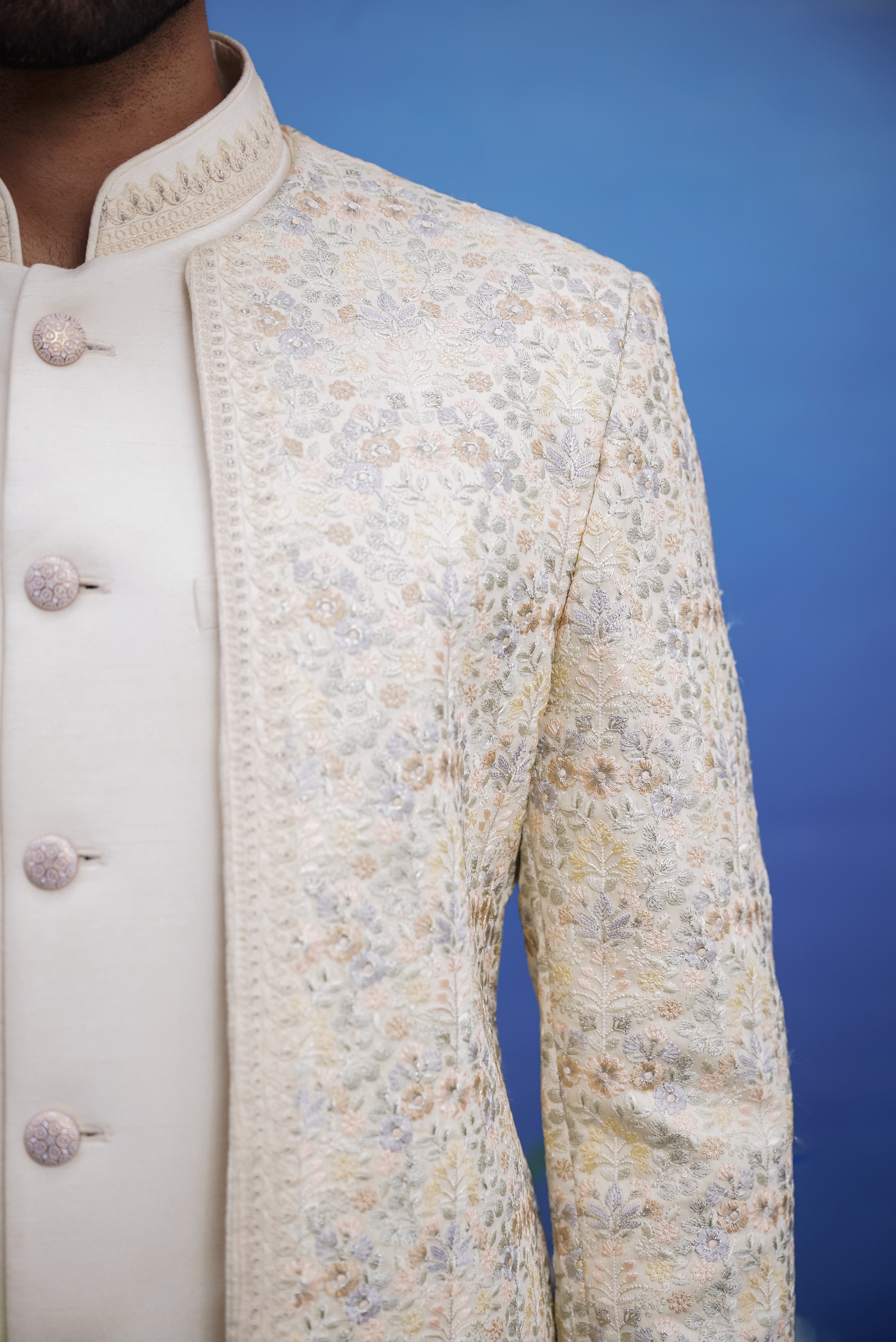 Close-up of the beige thread embroidered open Bandhgala suit, highlighting the thread embroidery and fabric texture.