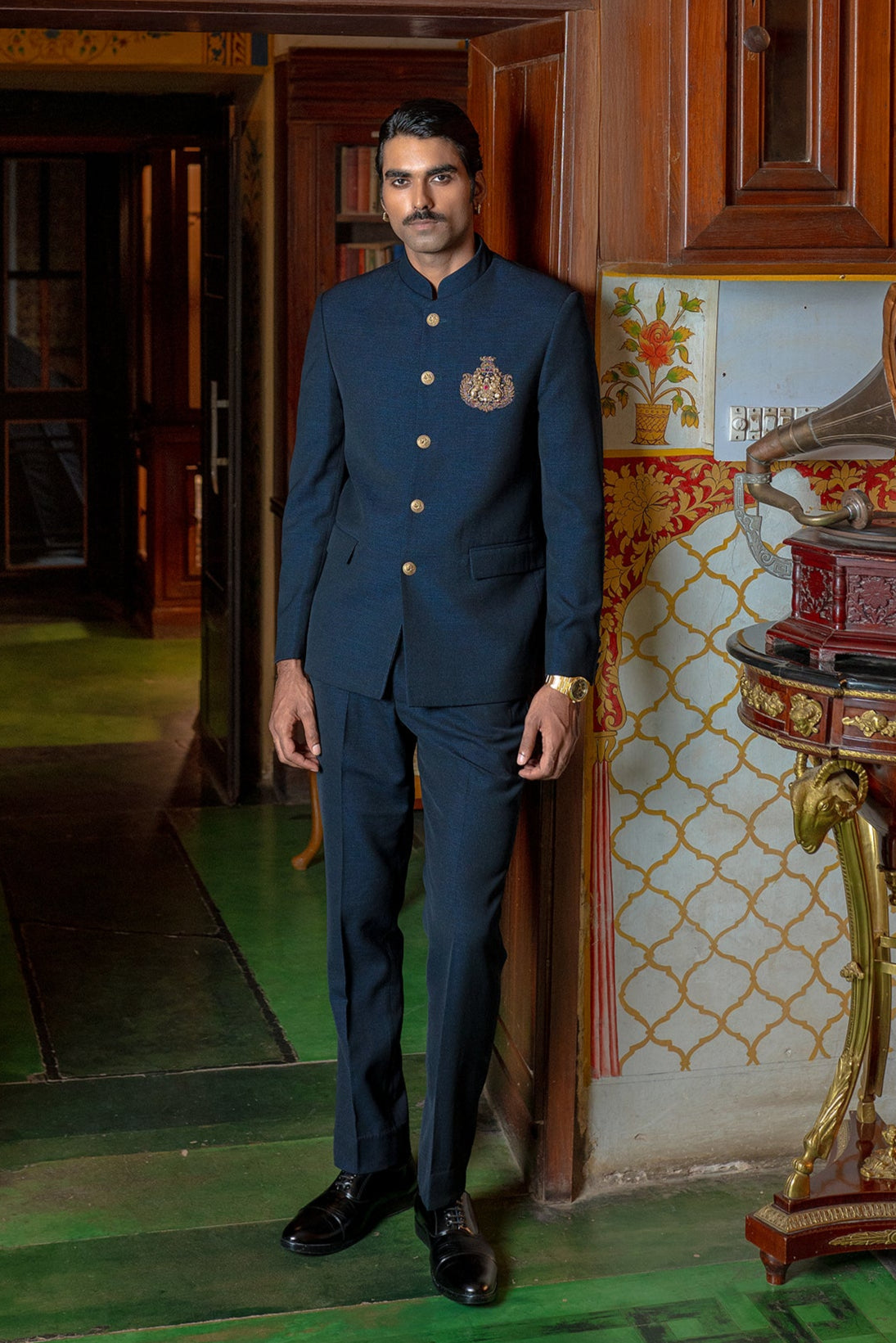 blue bandhgala with handcrafted lion brooch
