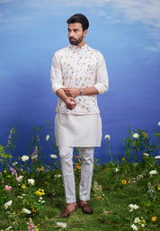 A cream Nehru jacket with an animal motif print, featuring a mandarin collar, ideal for men's party wear.