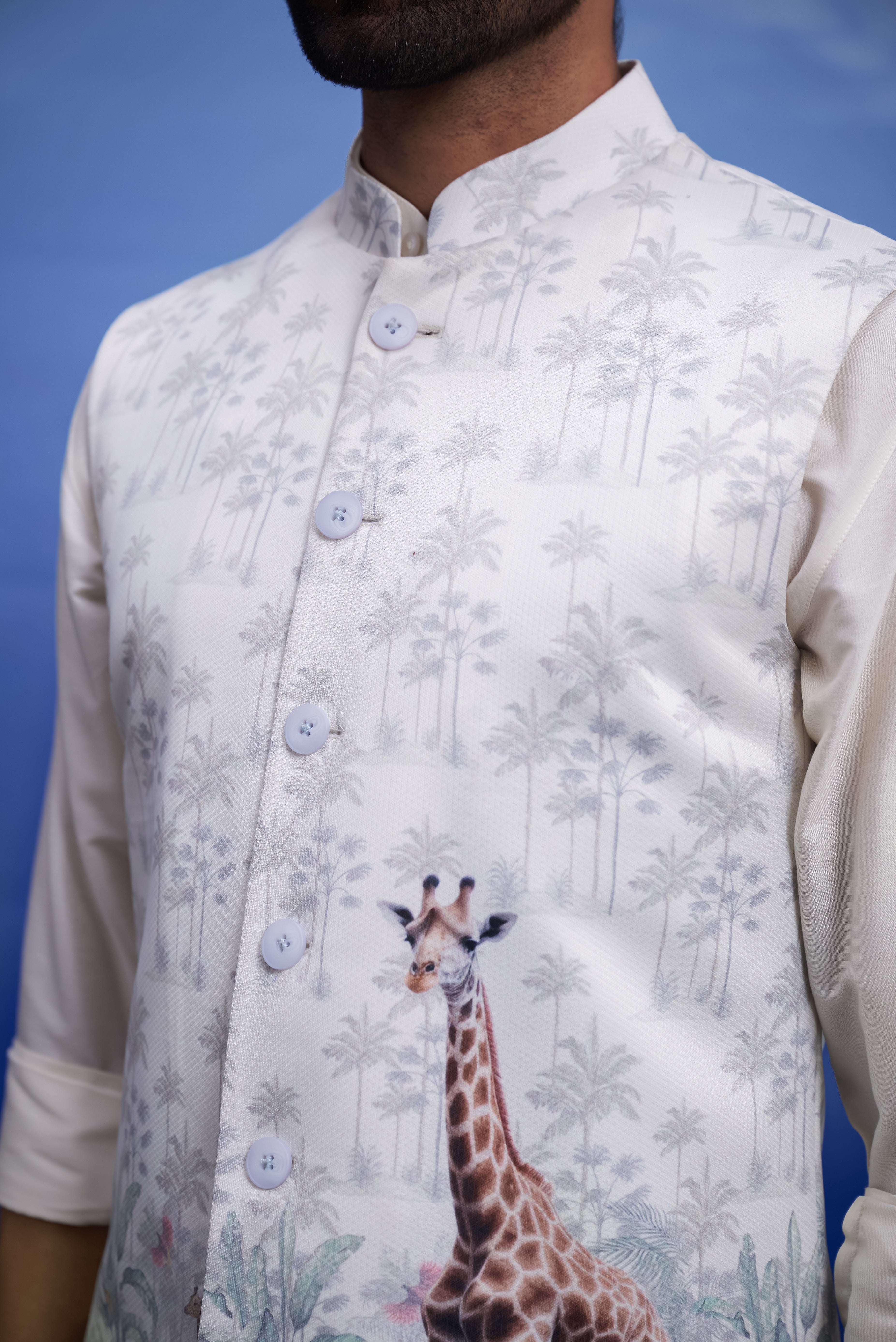 Close-up of the animal motif Nehru jacket, highlighting the print and knitted fabric.