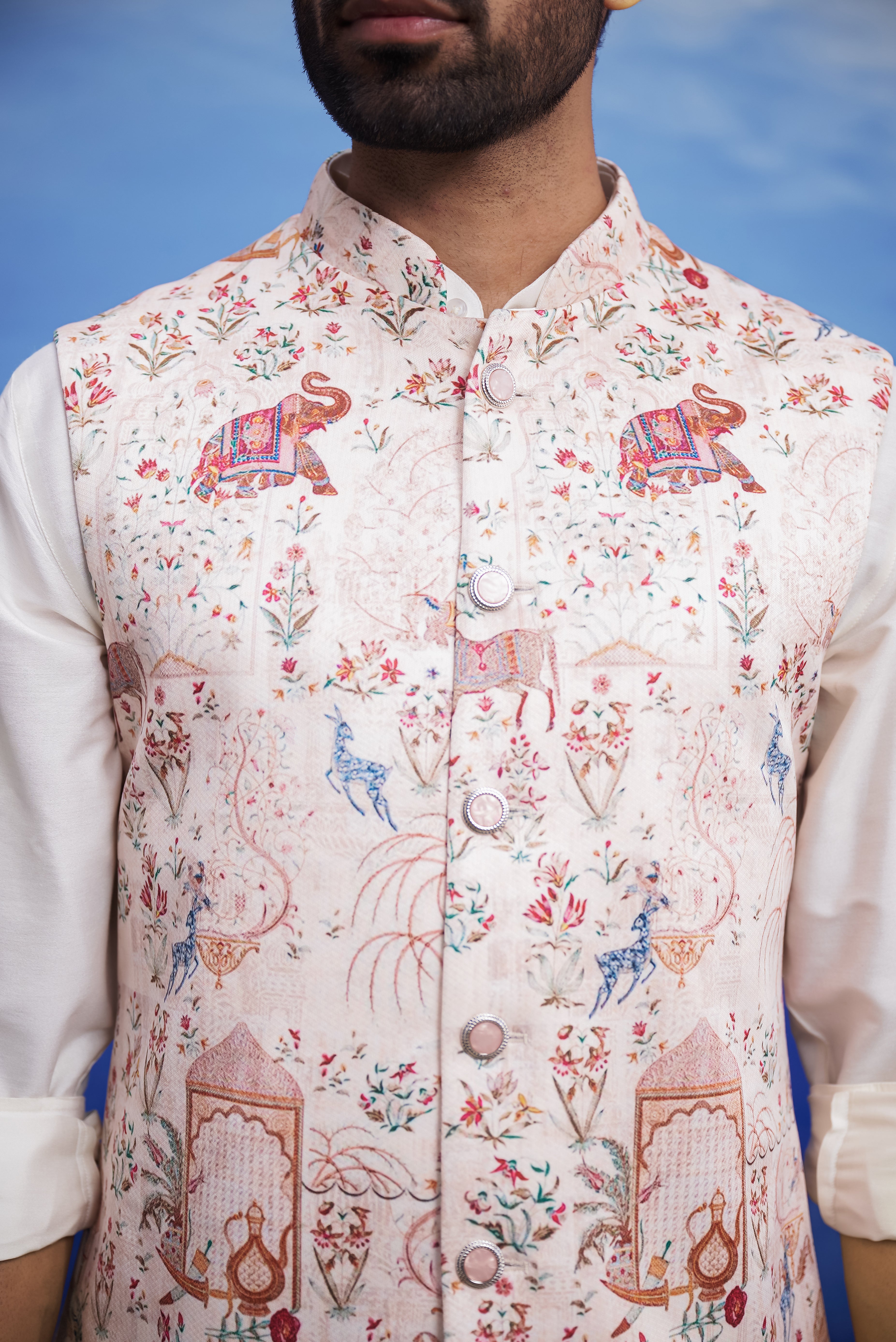 Close-up of the animal motif printed Nehru jacket, highlighting the print and knitted fabric.