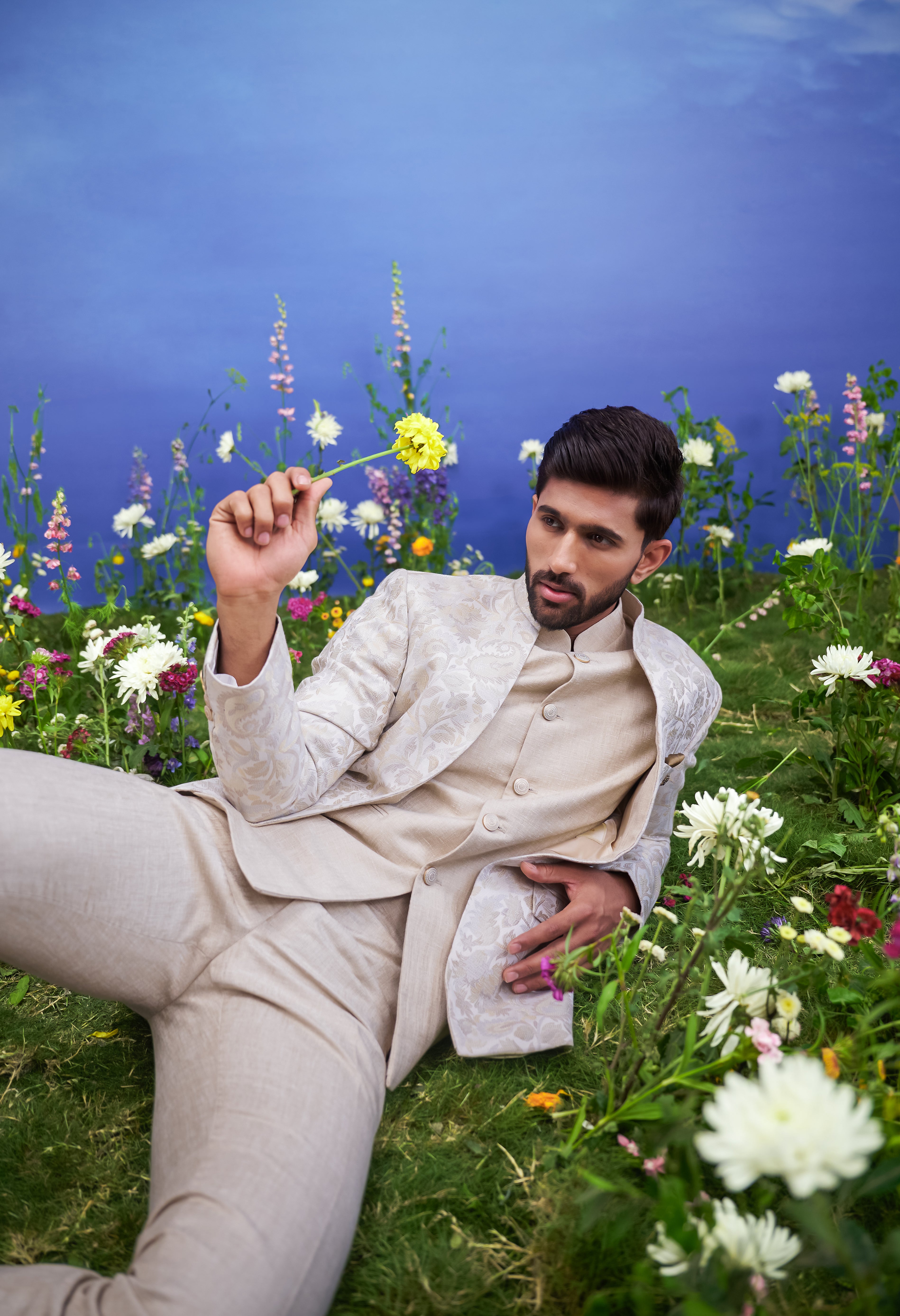 Men's beige Bandhgala suit with jacquard pattern and linen jacket, displayed on a product page with size options.