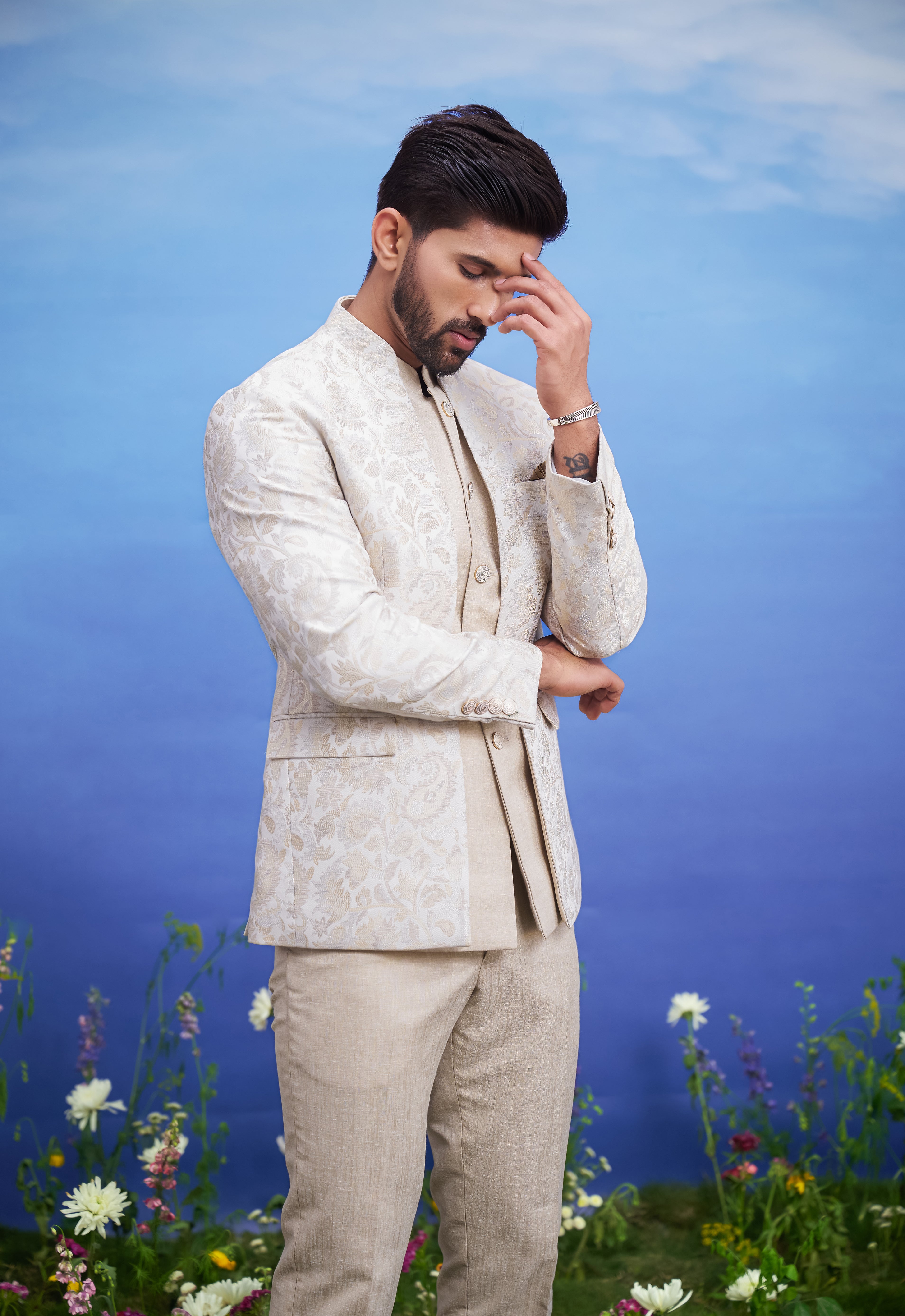 Beige jacquard Bandhgala suit for men, blending traditional elegance with modern styling, including a linen jacket, suitable for weddings.