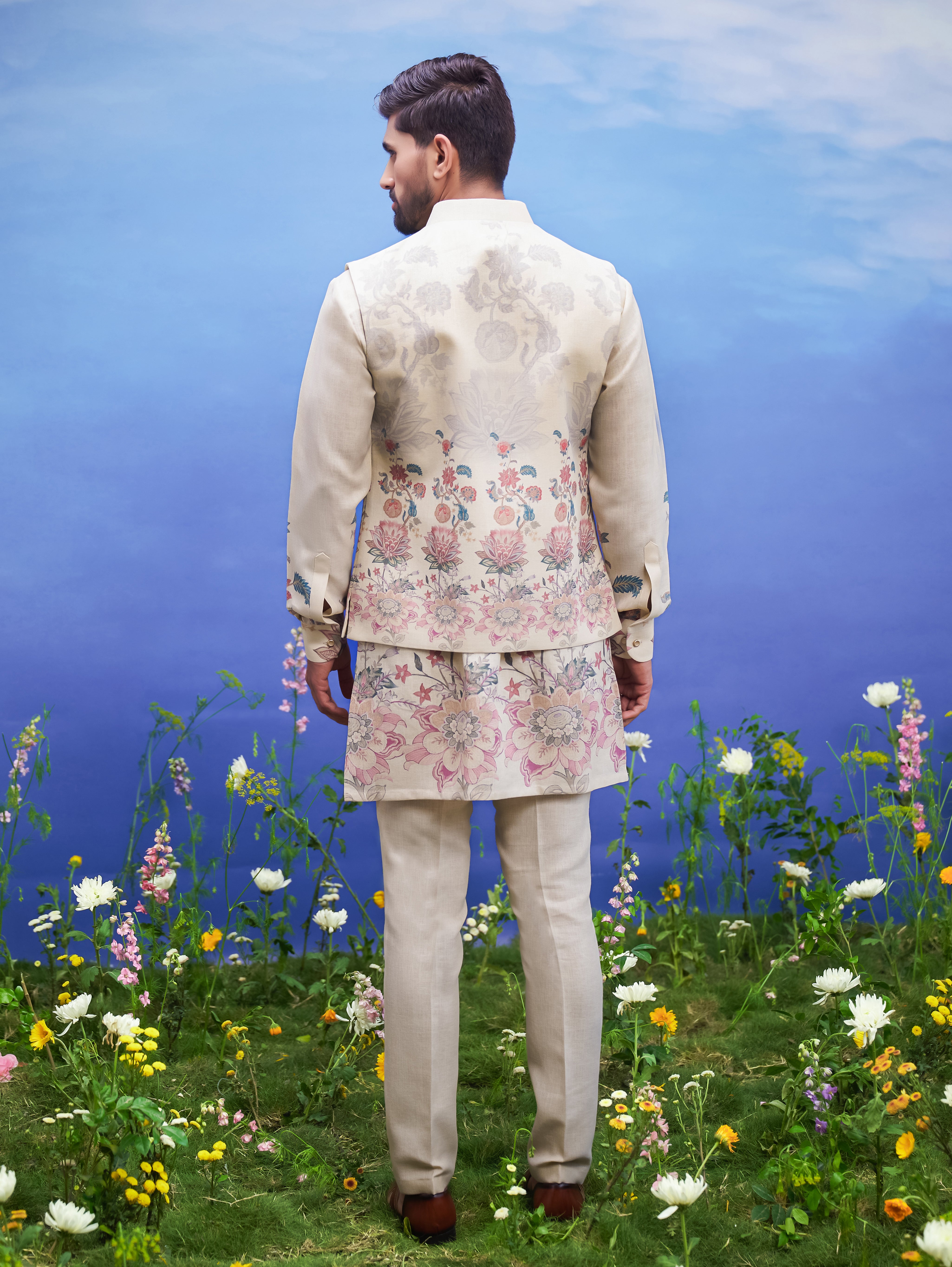 Men's beige kurta jacket set featuring a linen blend kurta, front open jacket, pajama, and pin.