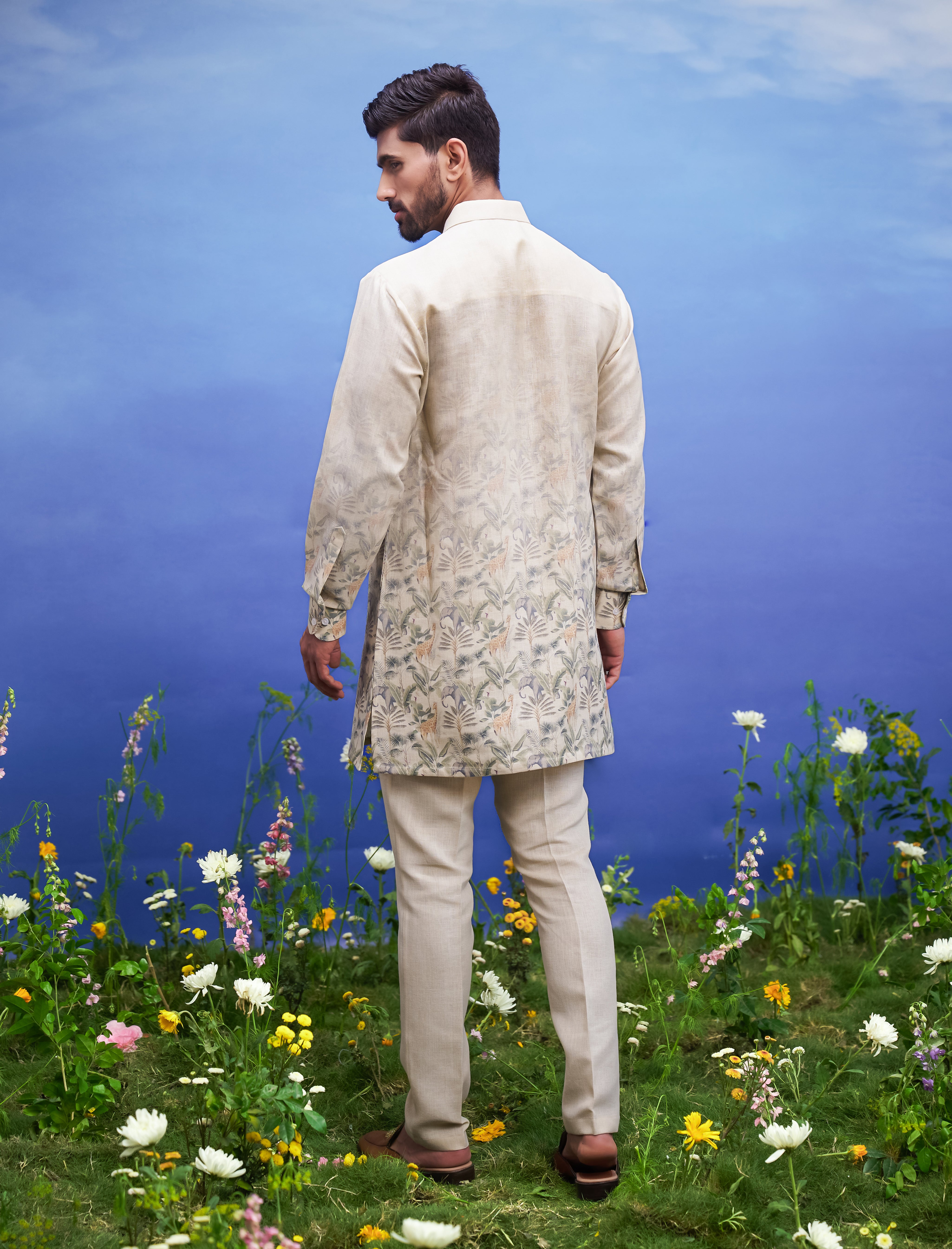 A classic beige linen kurta set, suitable for various occasions, with a floral pattern.