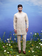 Unisex beige kurta set made of linen blend, displayed on a product page with size options.