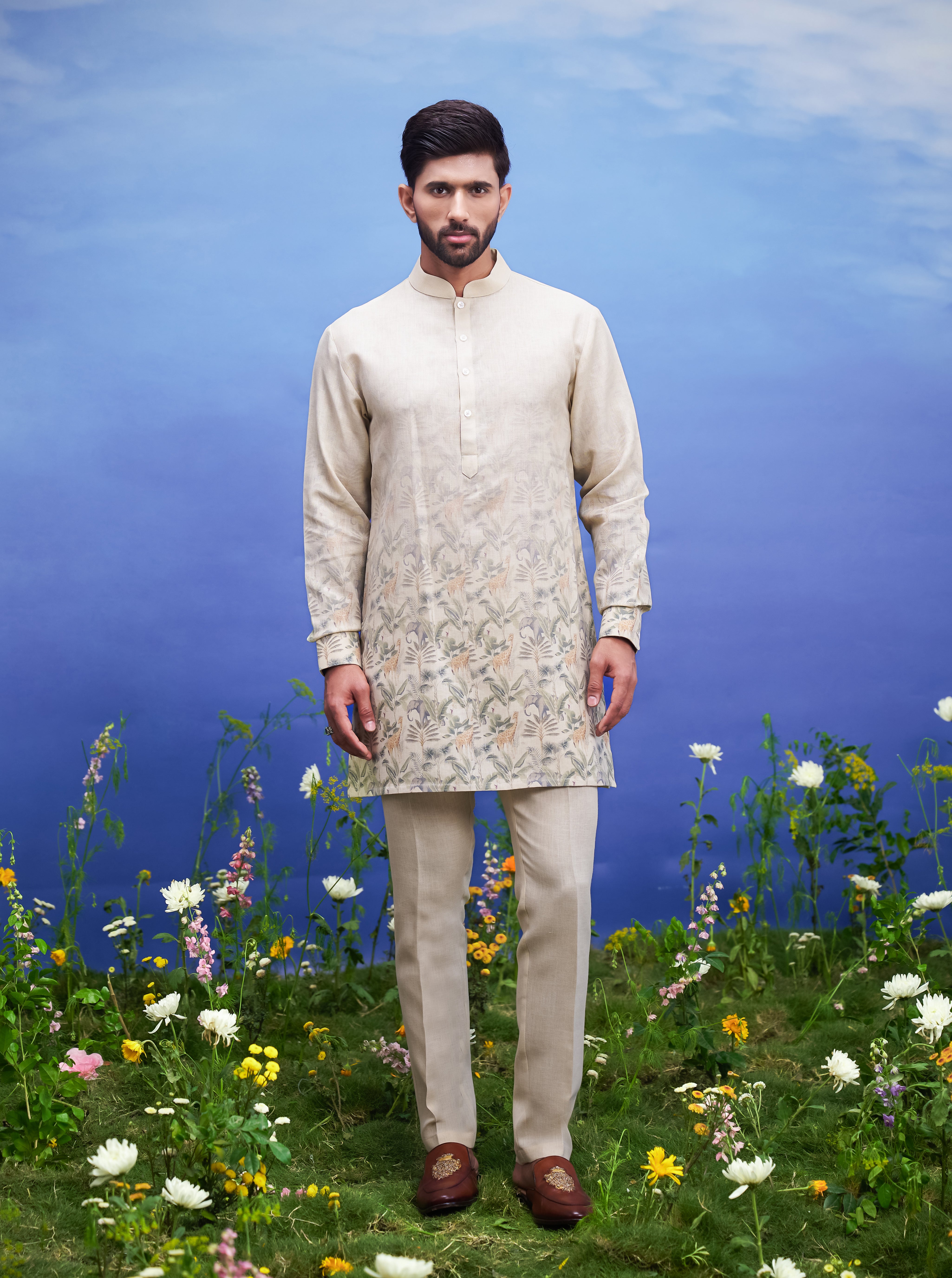 Unisex beige kurta set made of linen blend, displayed on a product page with size options.