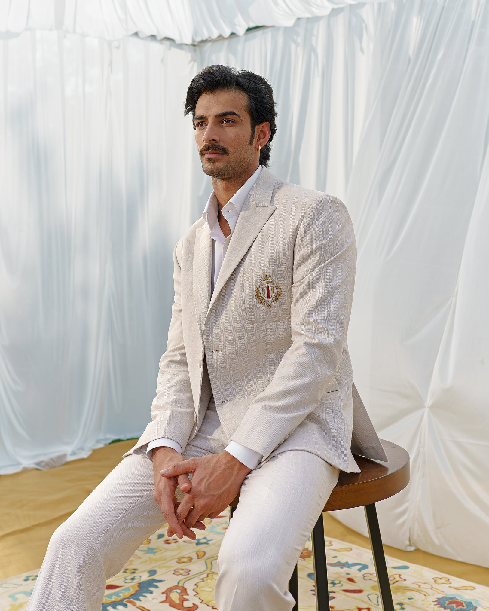 Beige blazer with designer motif