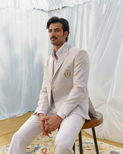 Beige blazer with designer motif