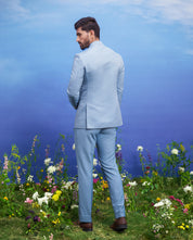 A sophisticated blue Bandhgala suit with a jacquard design, ideal for formal occasions.