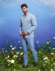 Blue jacquard Bandhgala suit, men's ethnic formal wear, featuring a jacquard Bandhgala, trousers, pocket square, and pin.