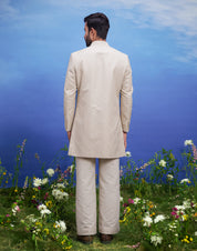 Detailed view of the zari work on a cream floral embroidered Indo-western jacket, showcasing the craftsmanship.