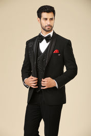 A luxurious black embroidered tuxedo suit with double-breasted vest, a timeless classic.
