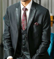 A versatile green suit with designer vest, suitable for various occasions.
