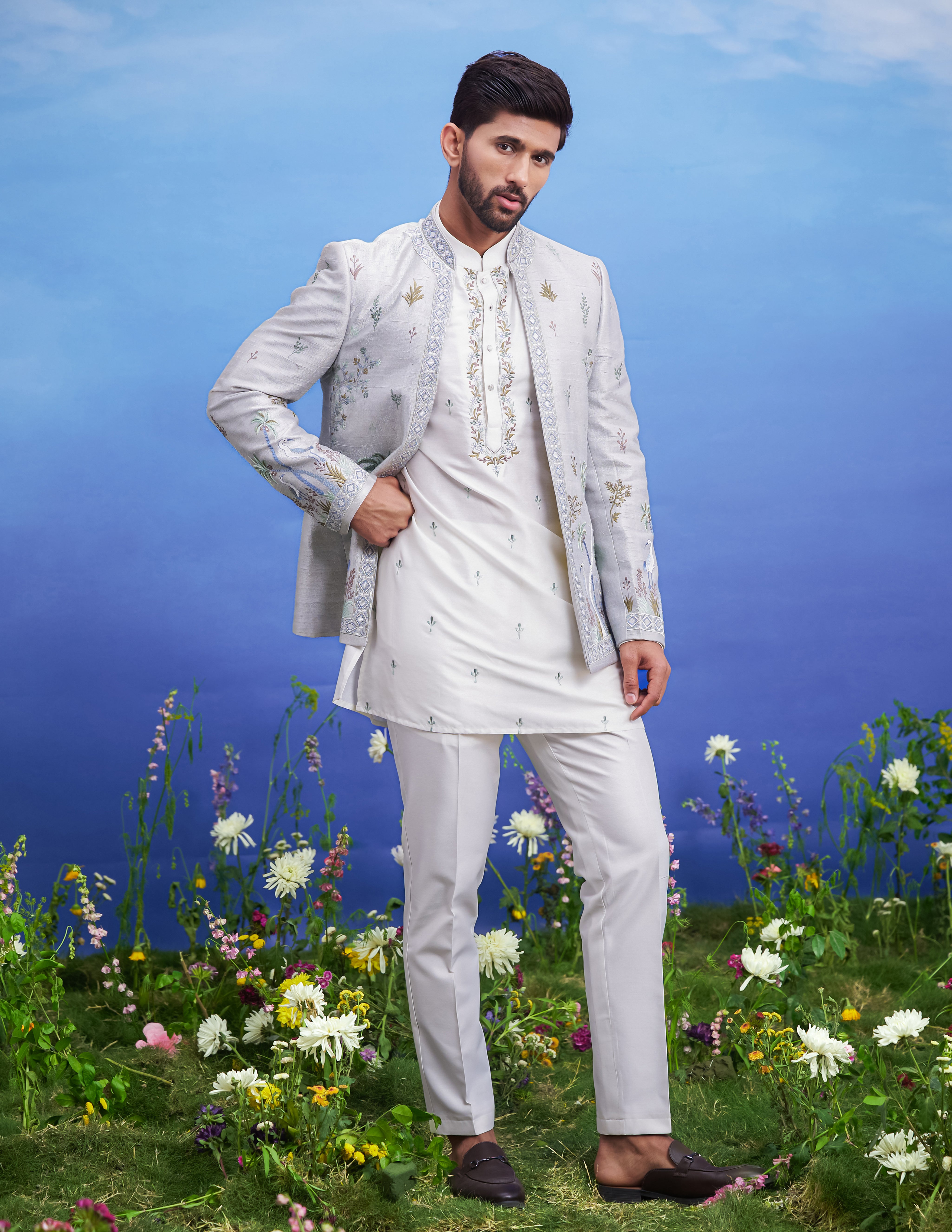 A detailed view of the grey raw silk front open embroidered Bandhgala, showcasing the raw silk fabric and embroidery.