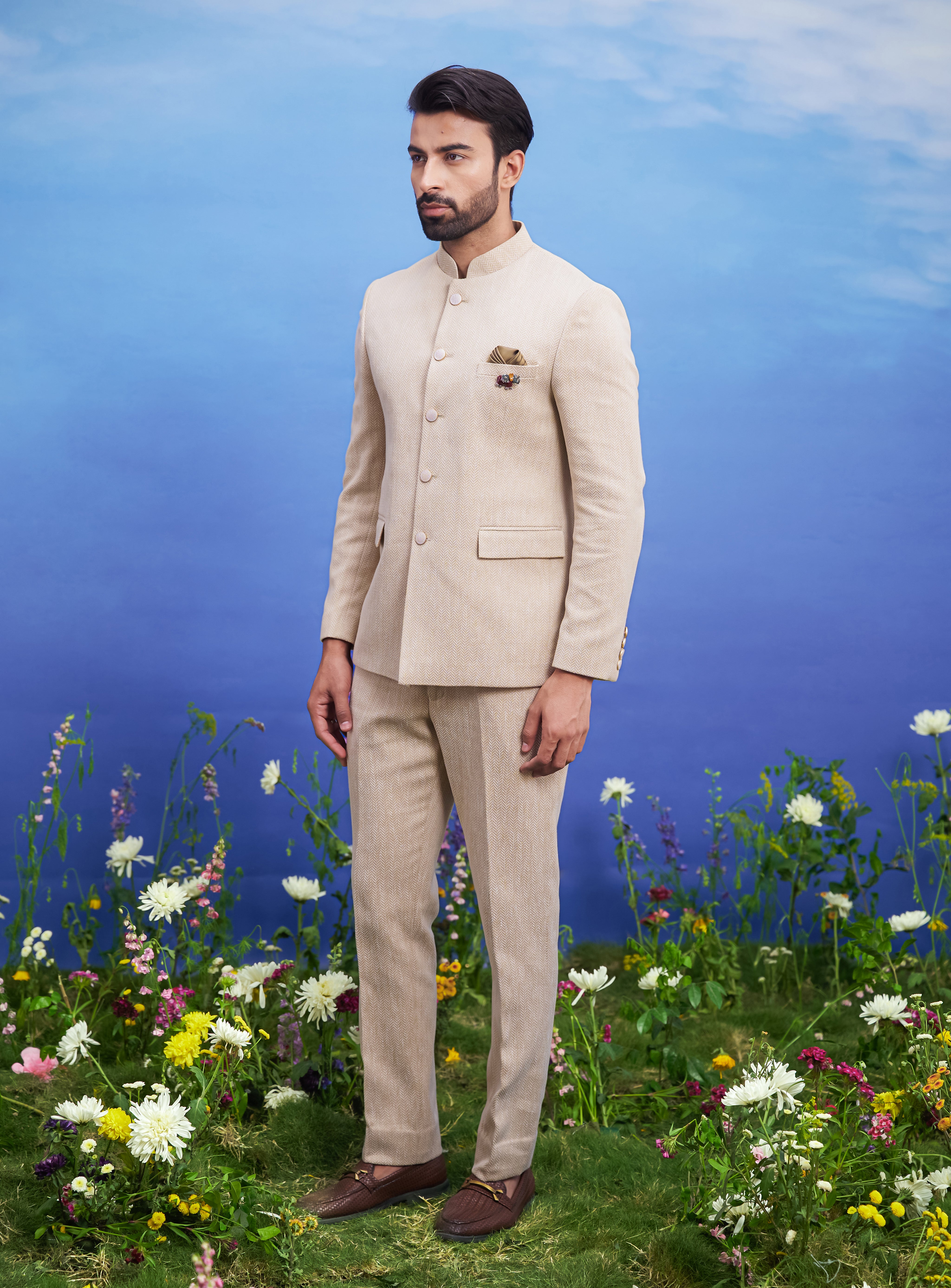 A detailed view of the beige Herringbone structured Bandhgala suit, showcasing the structured tailoring and fabric quality.
