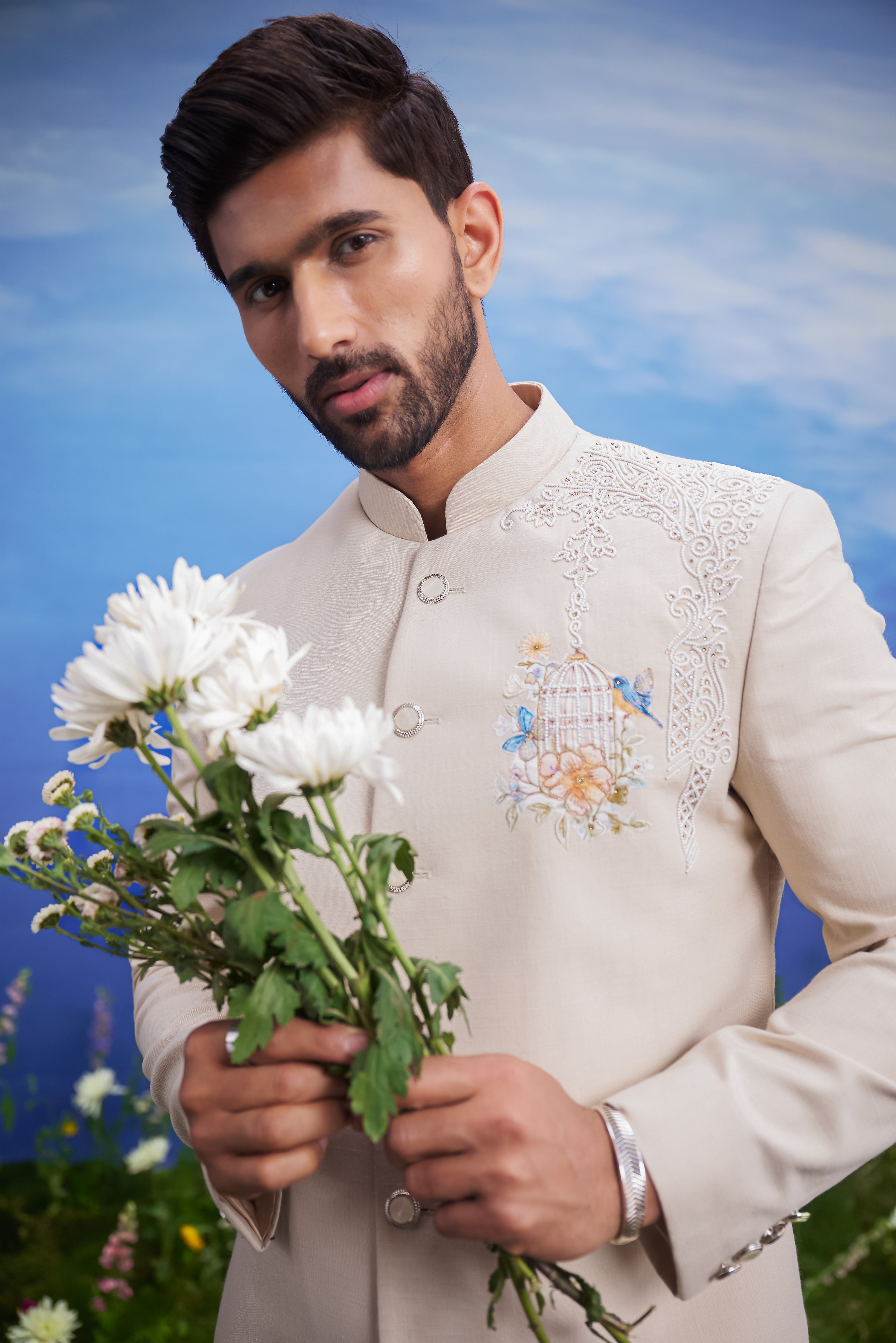 Close-up of the beige Indo-Western suit, highlighting the embroidered motif and linen blend fabric texture.