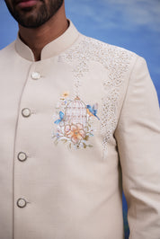 Close-up of the beige Indo-Western suit, highlighting the embroidered motif and linen blend fabric texture.