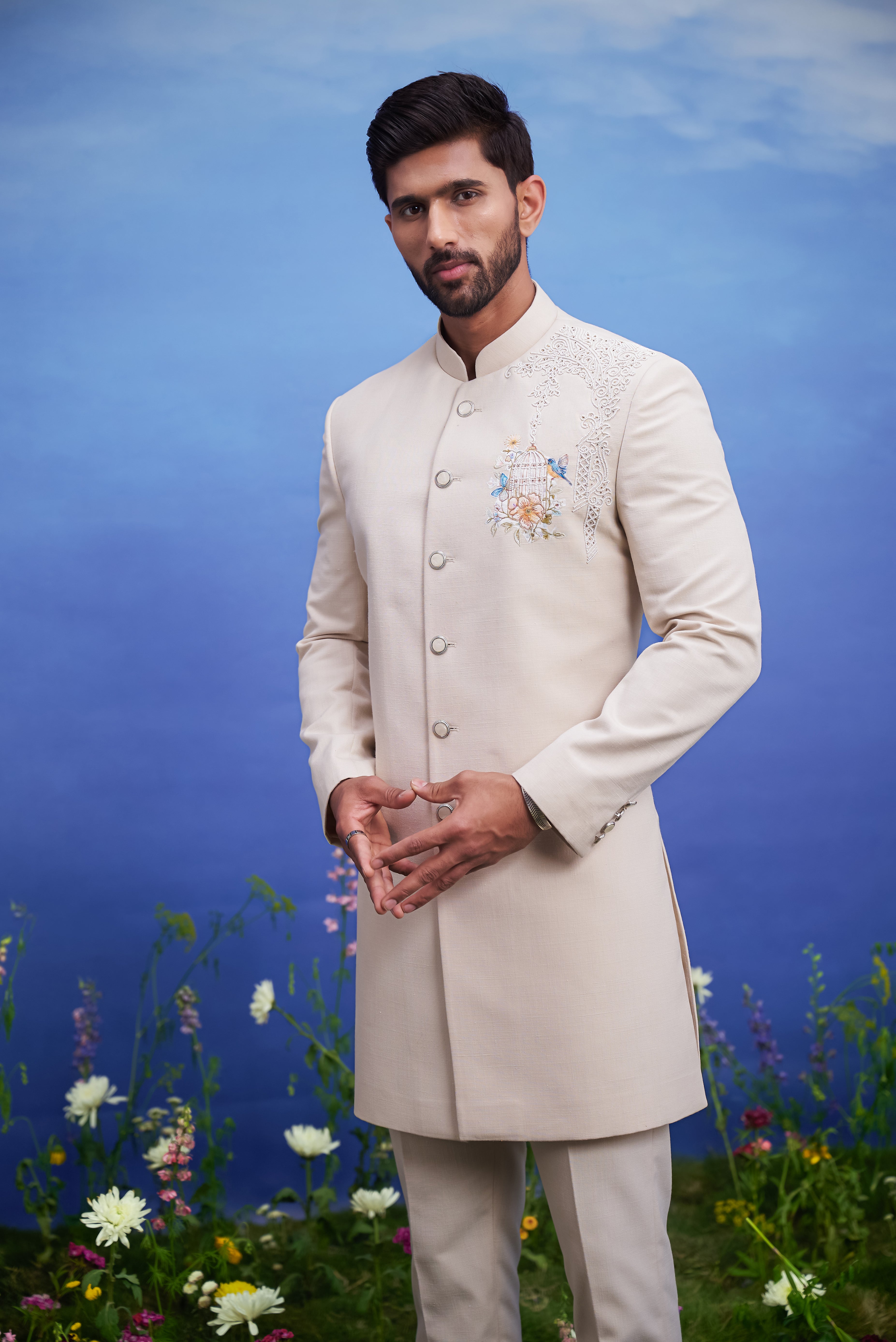 Beige Indo-Western outfit with embroidered motif, men's ethnic fusion wear, featuring a linen blend top and trousers.