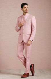 A luxurious light pink bandhgala with embroidered motif, perfect for special occasions.
