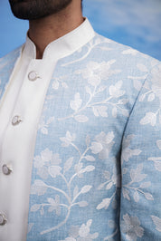 Men's light blue Bandhgala suit with an open front design and linen fabric, displayed on a product page with size options.