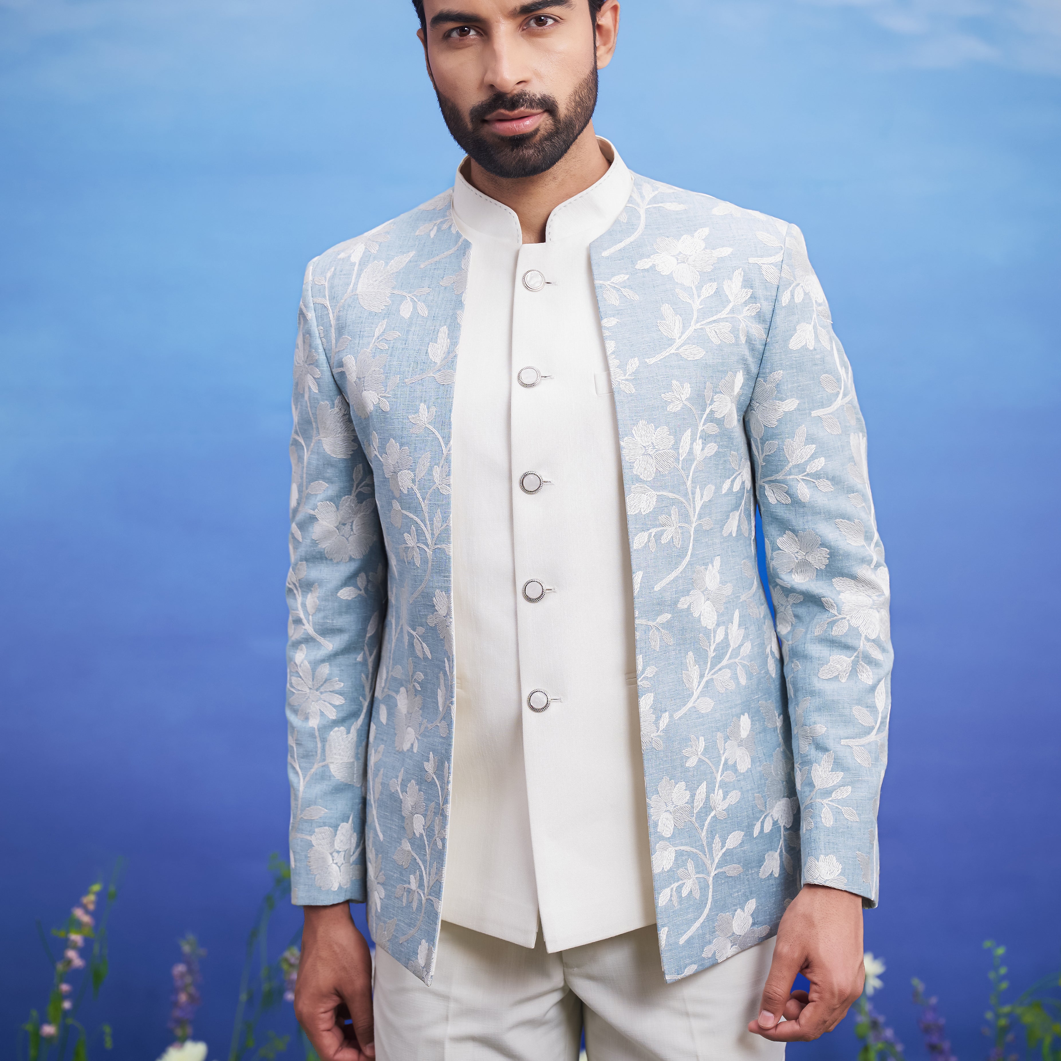 Men's light blue Bandhgala attire, suitable for weddings and festivals, featuring linen fabric, available in sizes 36 to 44 and custom.