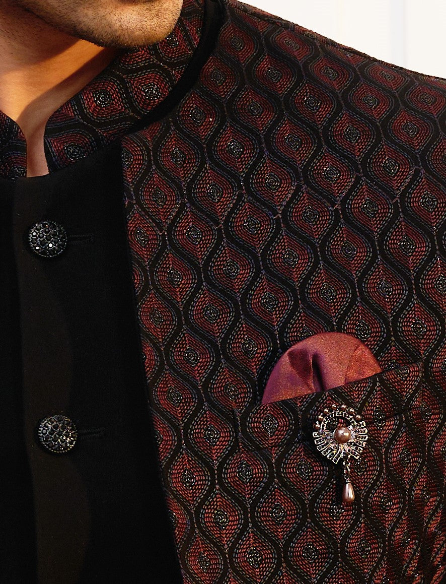 An elegant maroon embroidered open jacket bandhgala, traditional Indian attire.
