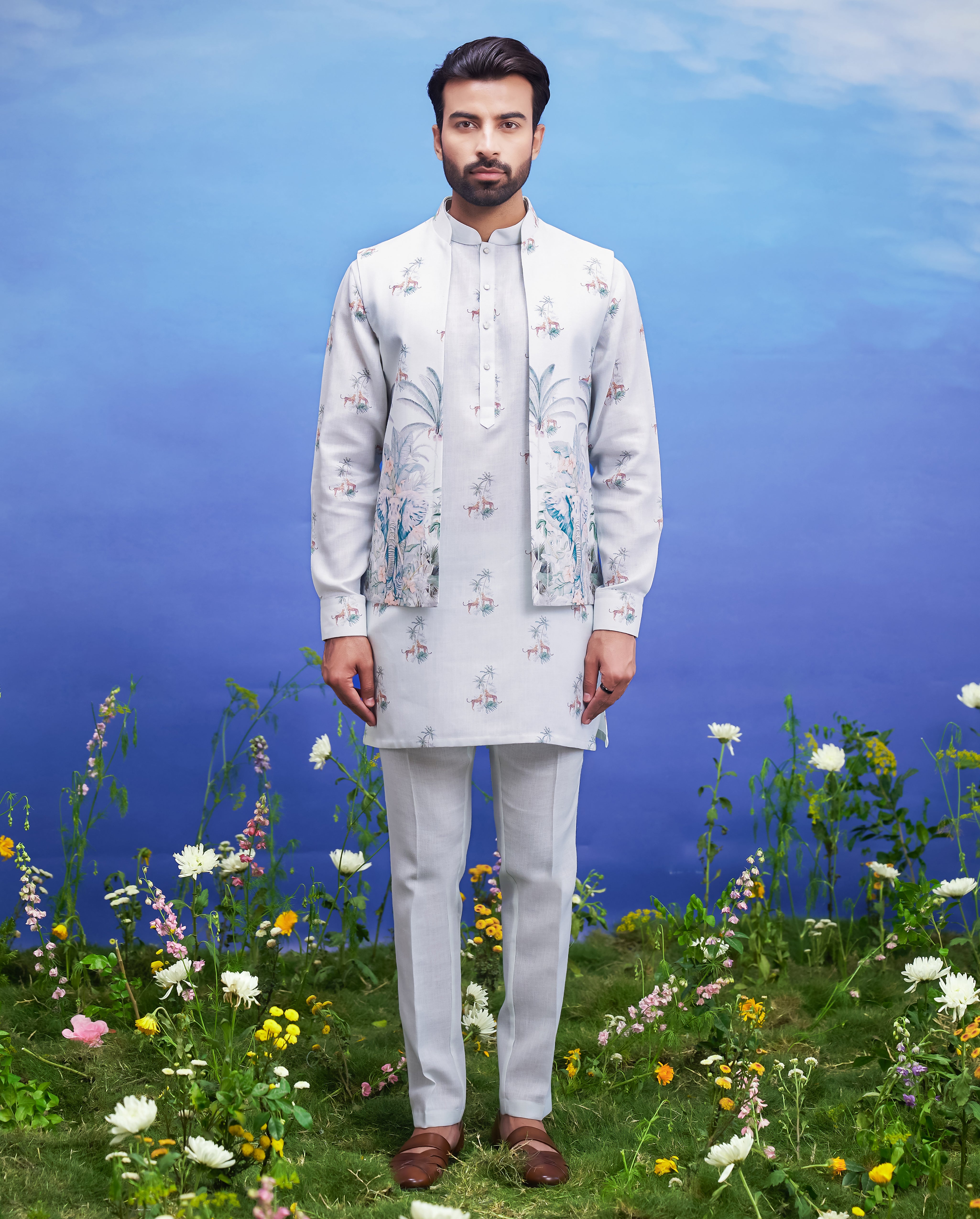 A mint green kurta jacket set, featuring a kurta, jacket, and pajama, ideal for men's ethnic wear.