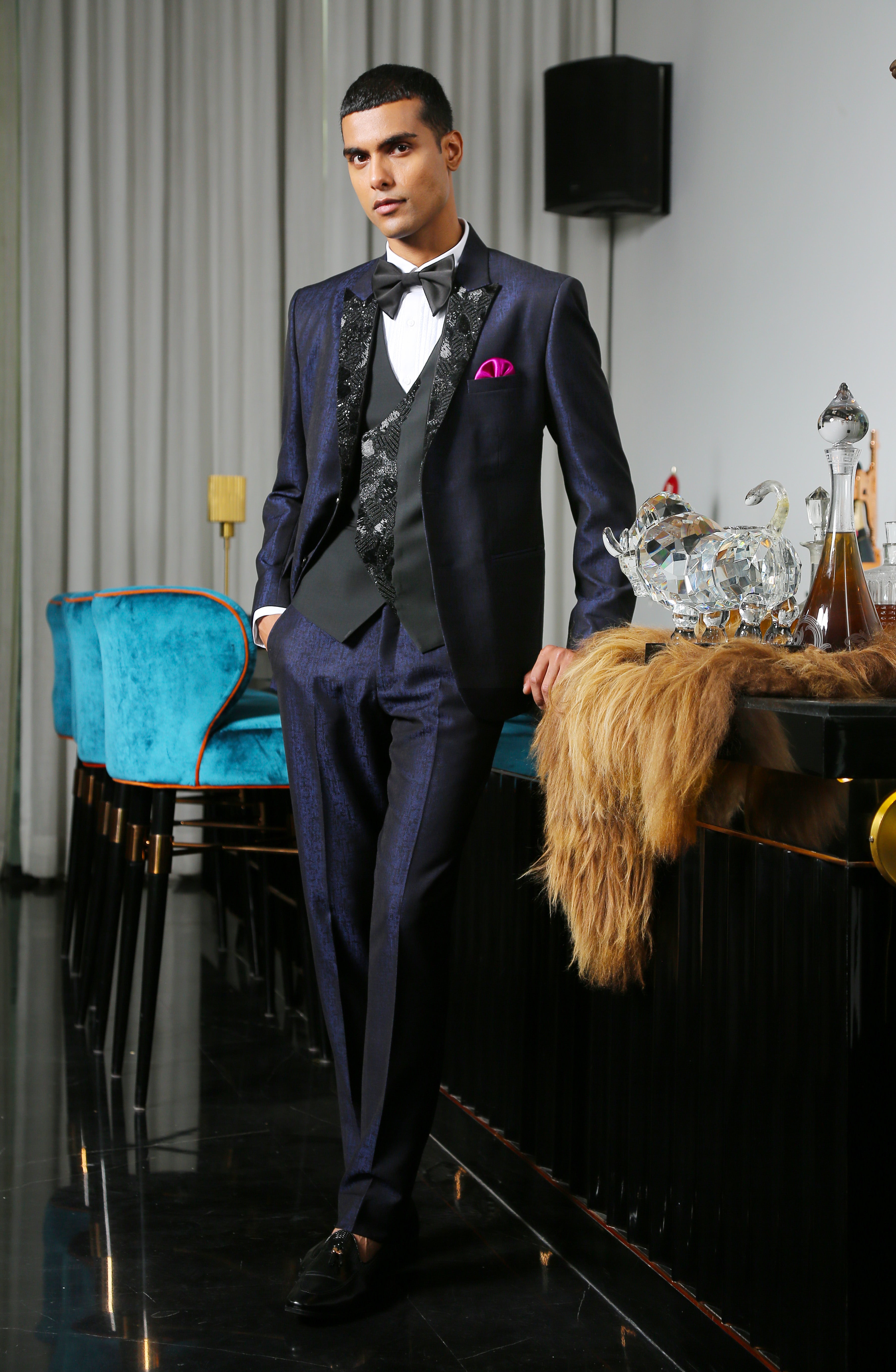 An elegant navy blue jacquard designer suit, modern men's fashion.
