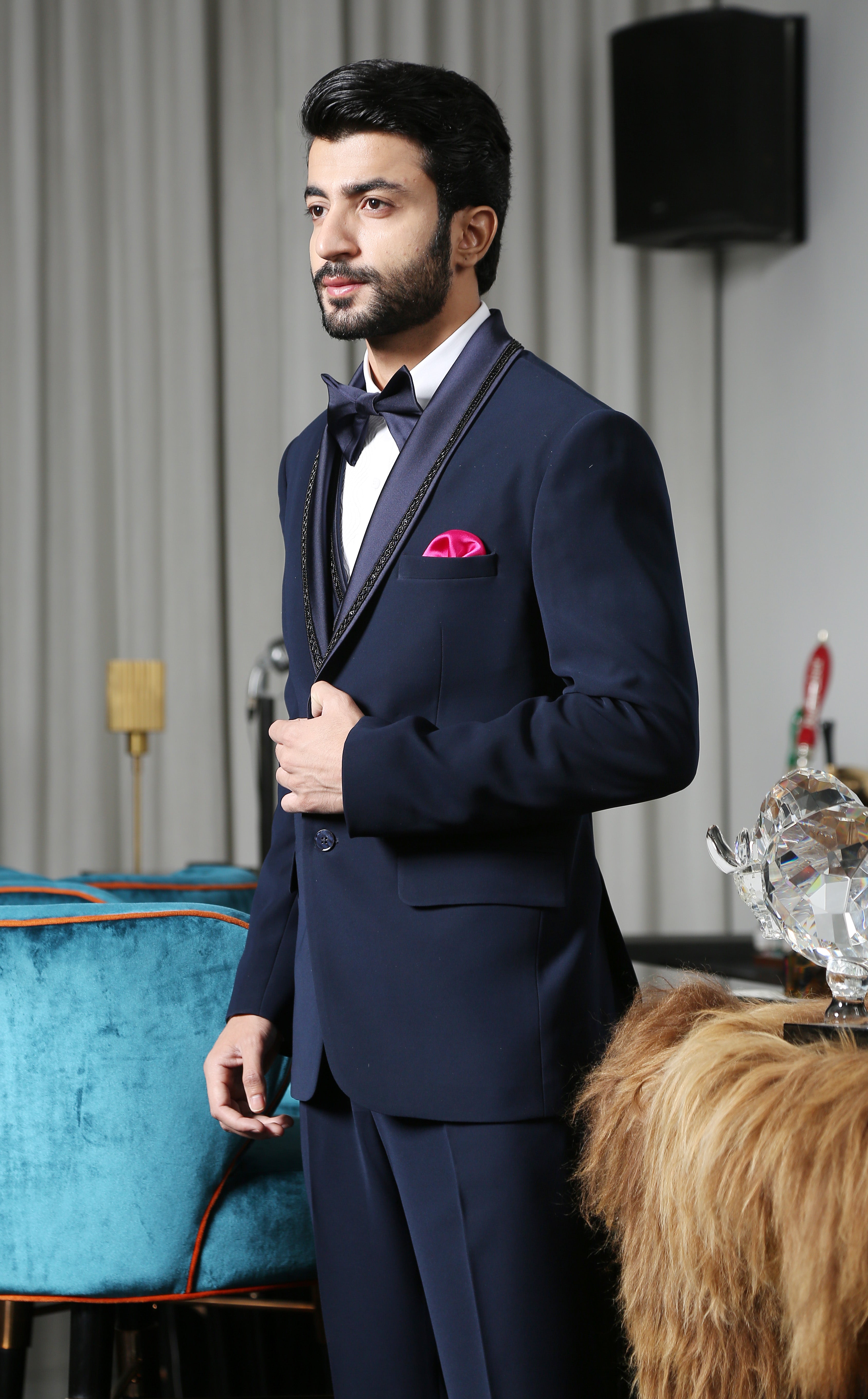 A versatile navy blue designer suit with embroidery, suitable for various occasions.
