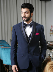 A trendy navy blue designer suit with embroidery, urban style.
