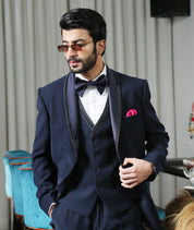 An elegant navy blue designer suit, modern men's fashion.
