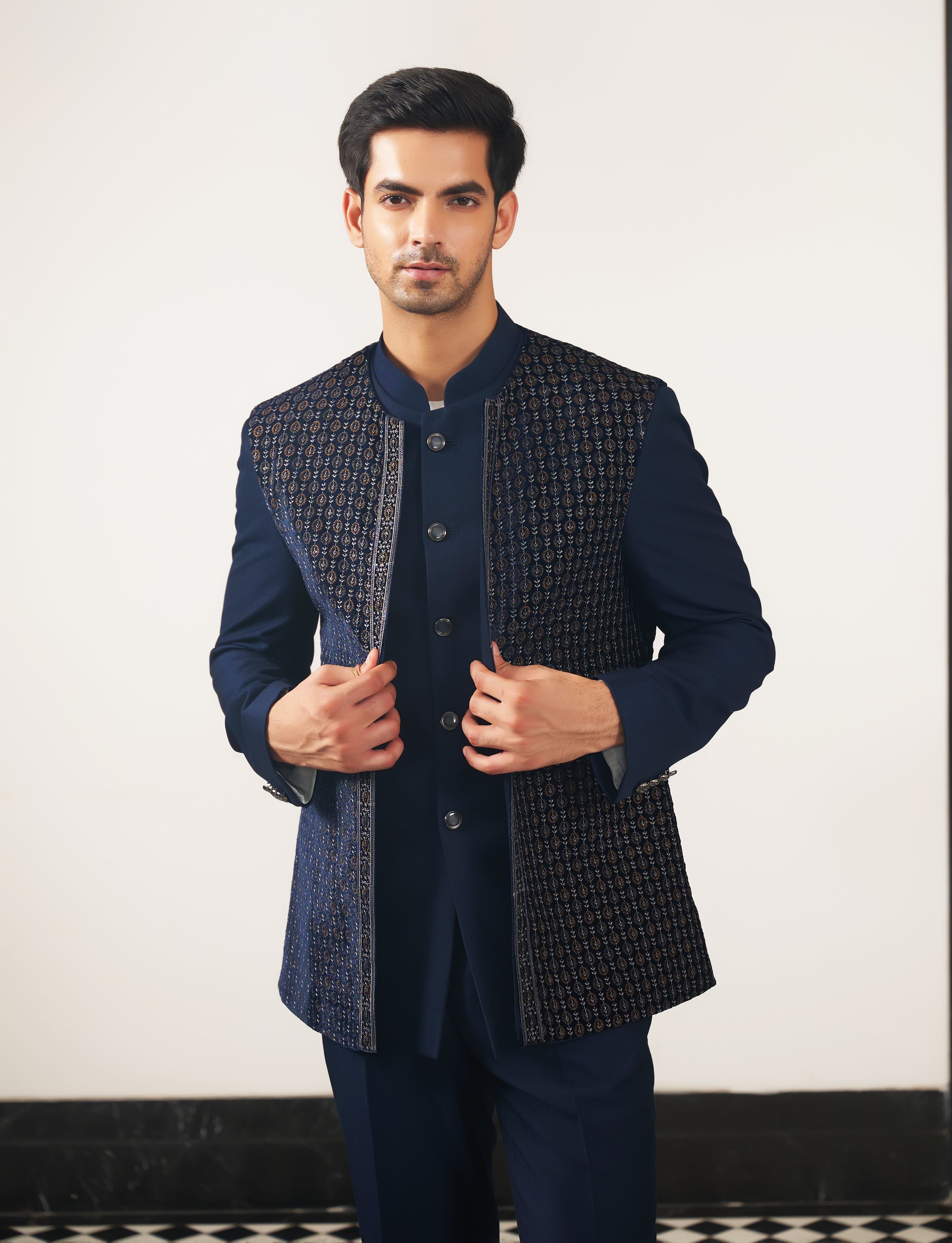 A stylish navy blue embroidered open jacket bandhgala, perfect for festive occasions.
