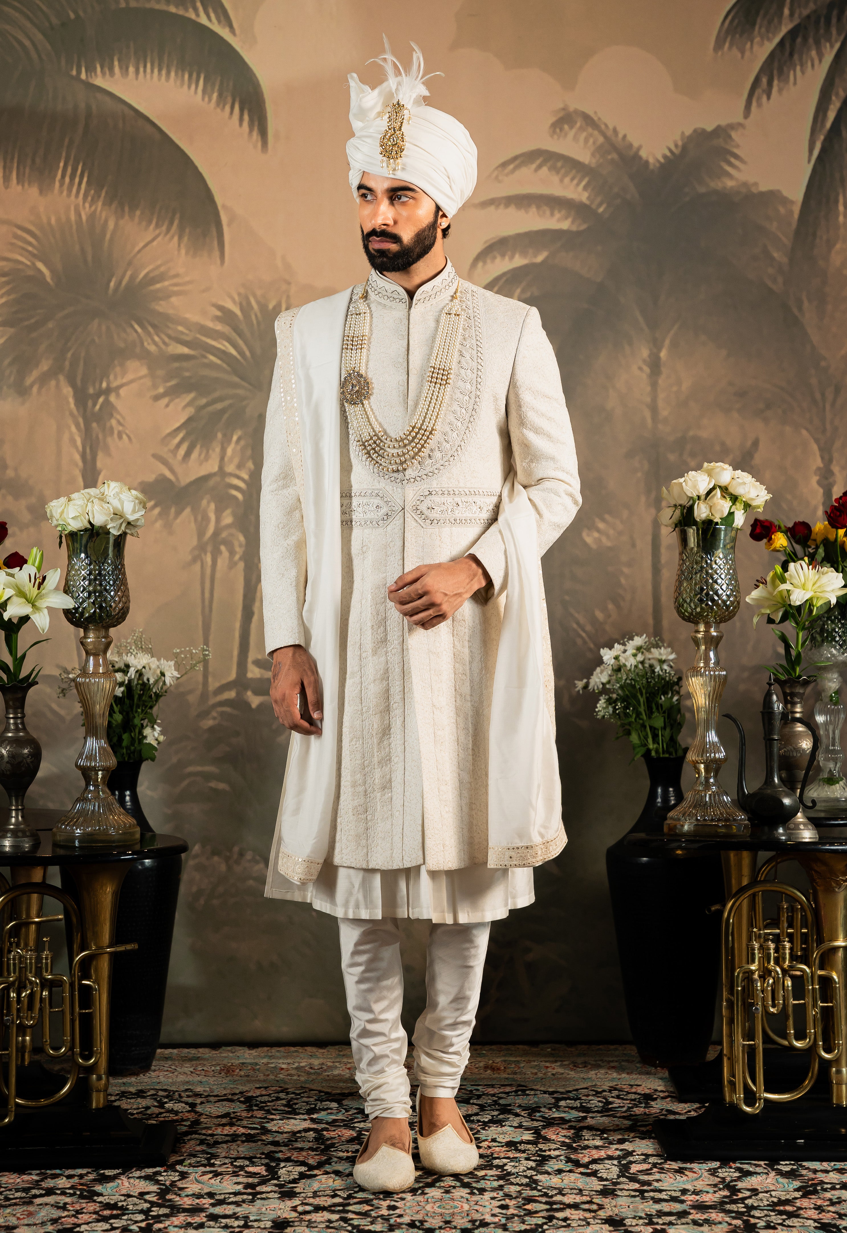 A trendy off-white silk sherwani, modern Indian fashion.
