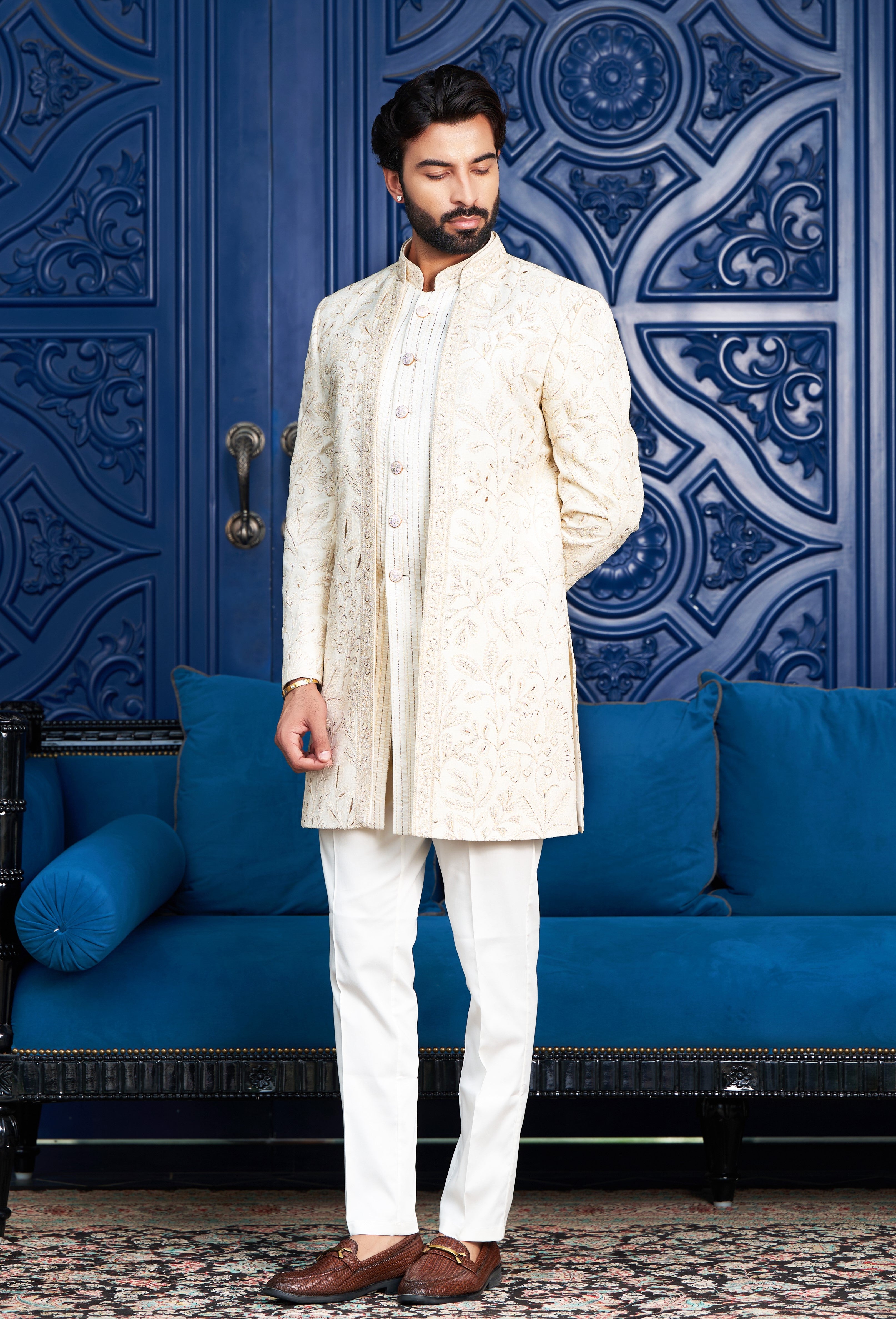A luxurious off-white open indo-western with dori work, perfect for special occasions.
