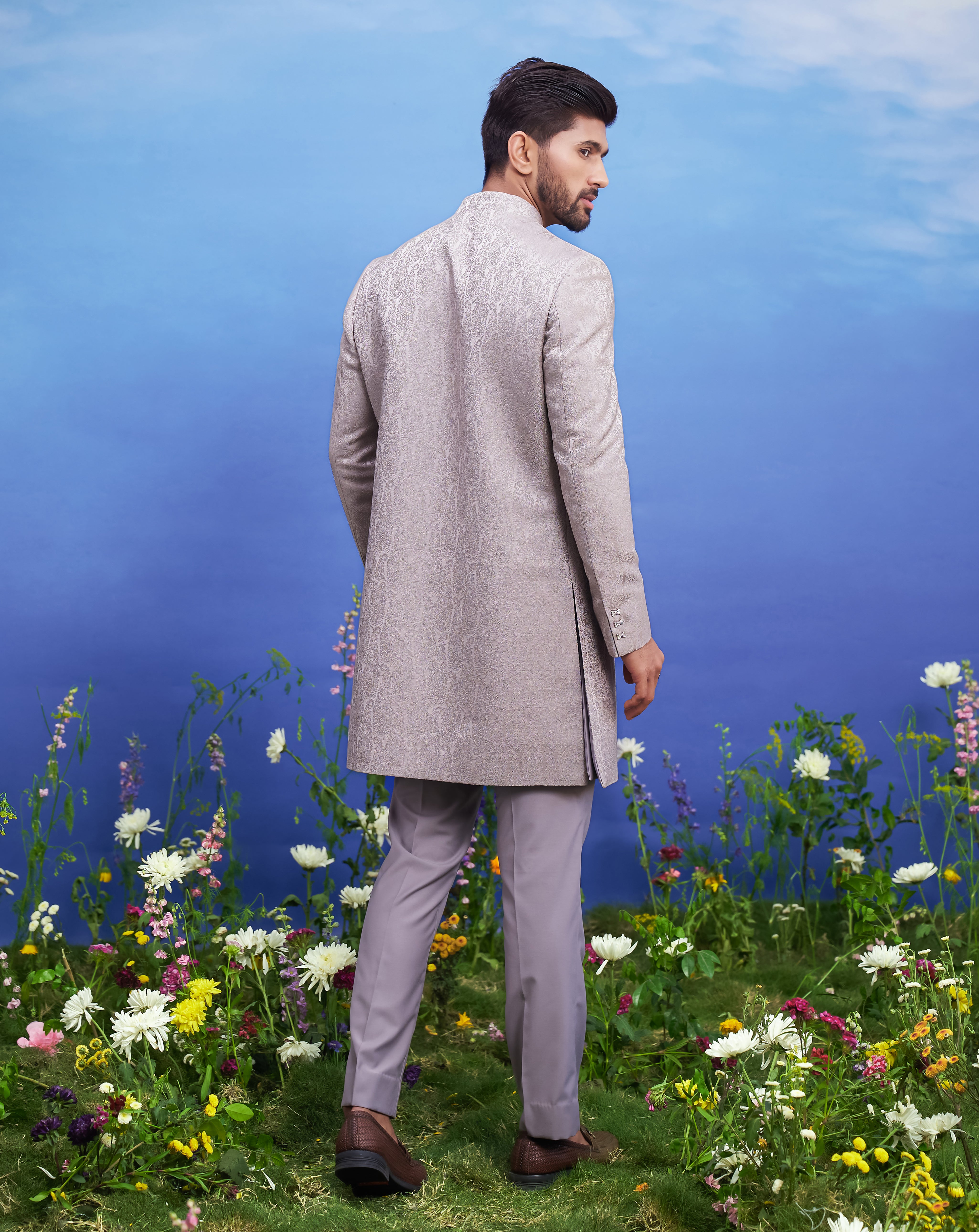 A sophisticated grey Indo-western suit with thread embroidery and an open front, ideal for formal occasions.