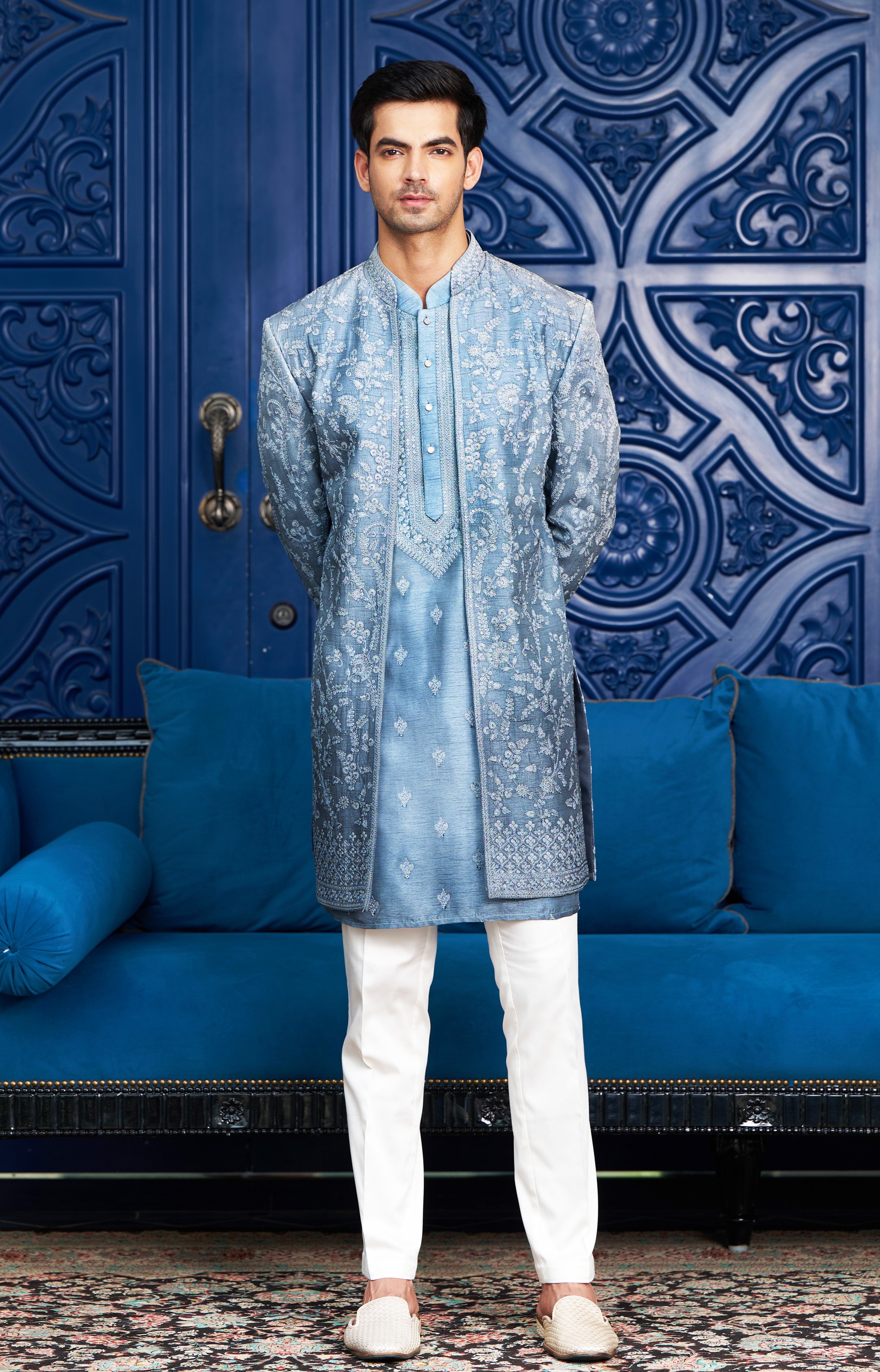 A luxurious blue open indo-western with dori work, perfect for special occasions.
