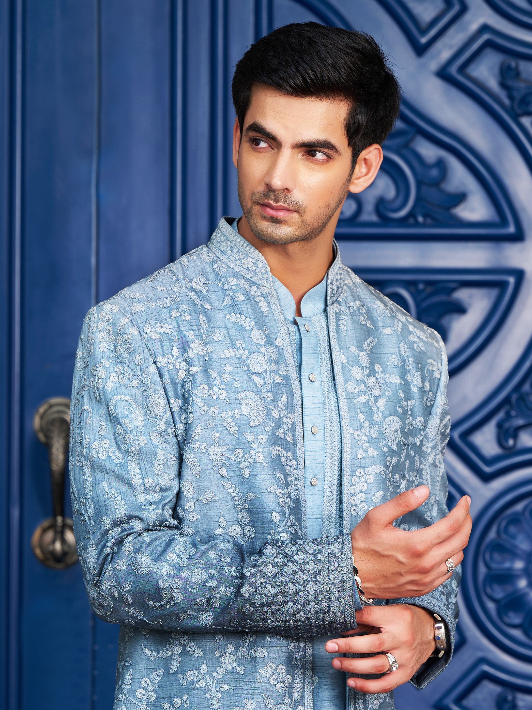 A trendy blue open indo-western with dori work, modern Indian fashion.
