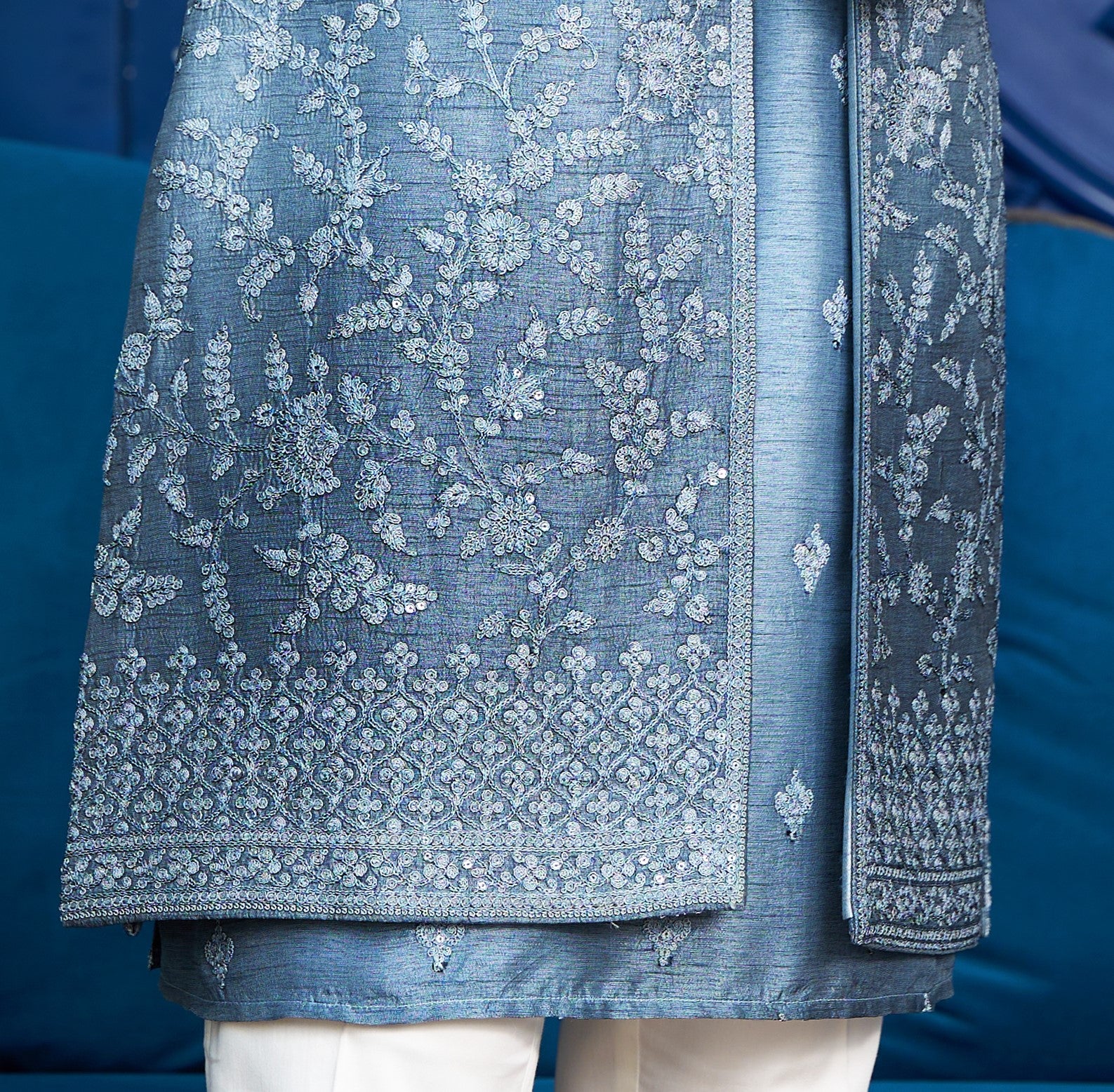 An elegant blue open indo-western, traditional Indian attire.
