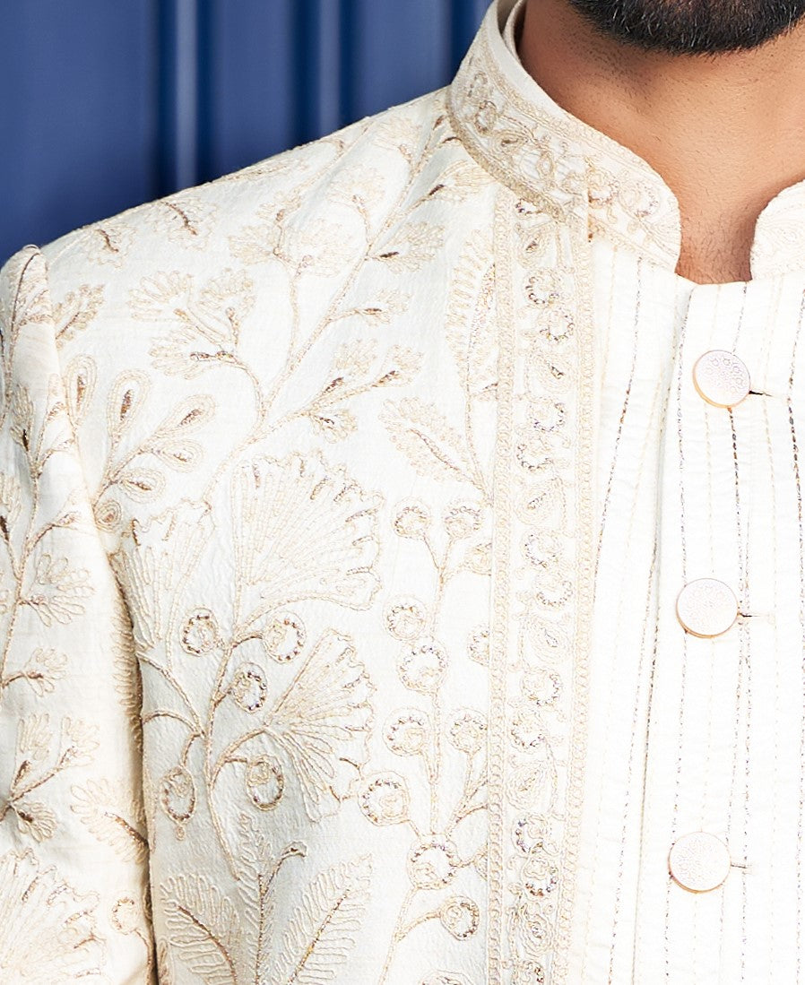 An elegant off-white open indo-western, traditional Indian attire.
