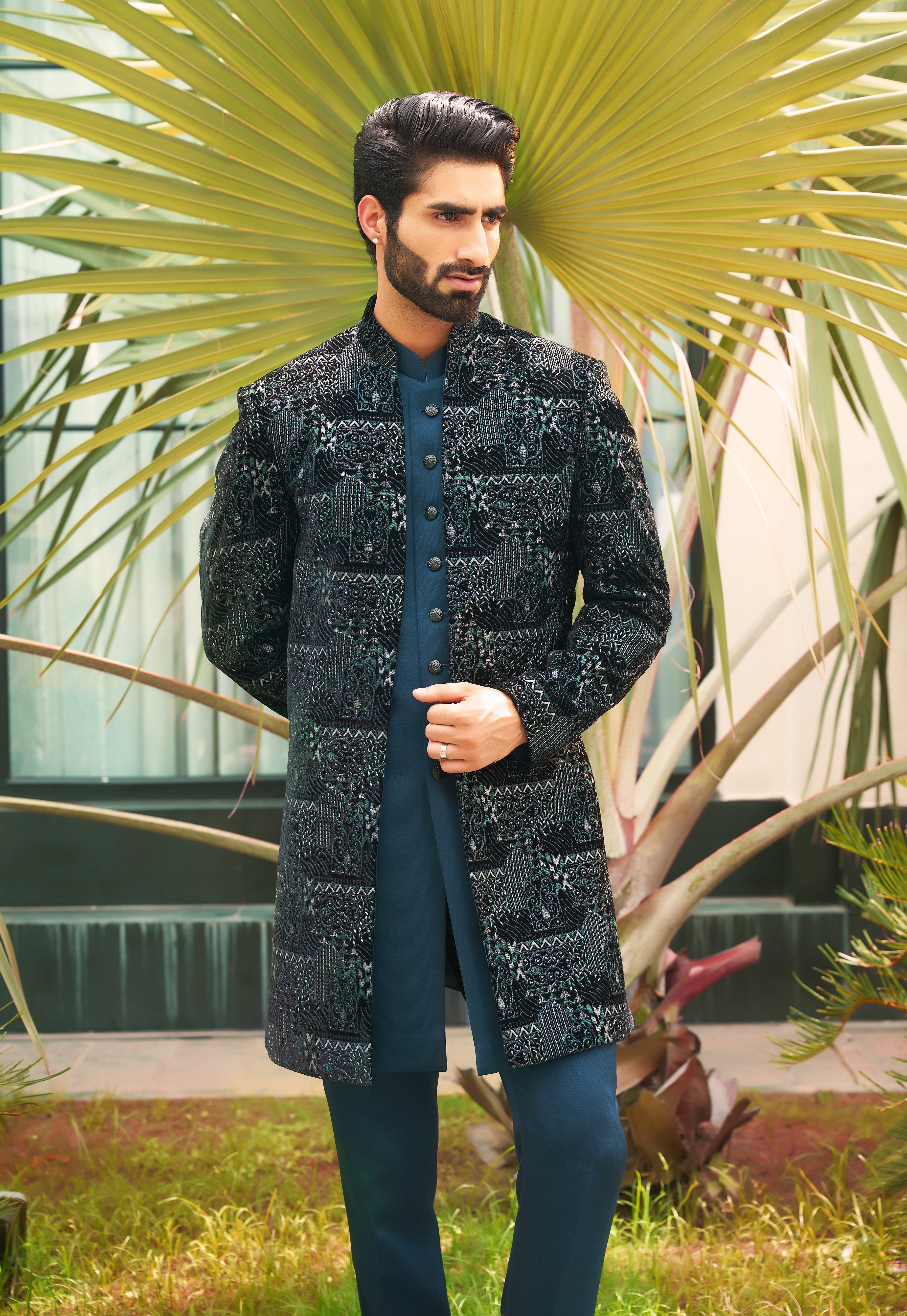 A stylish teal open indo-western with sleeveless jacket, perfect for weddings and parties.
