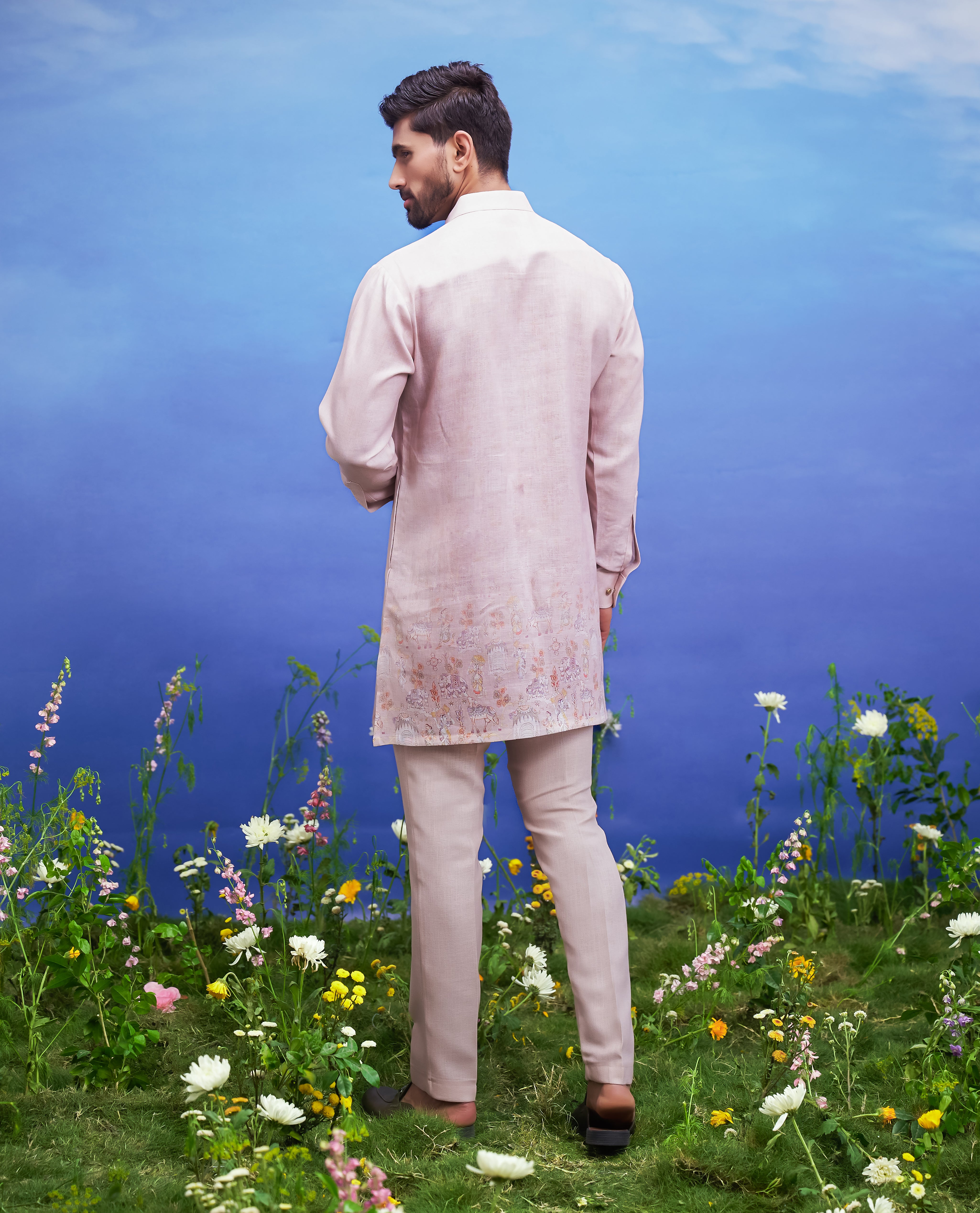 Men's peach kurta set made of linen blend, displayed on a product page with size options.