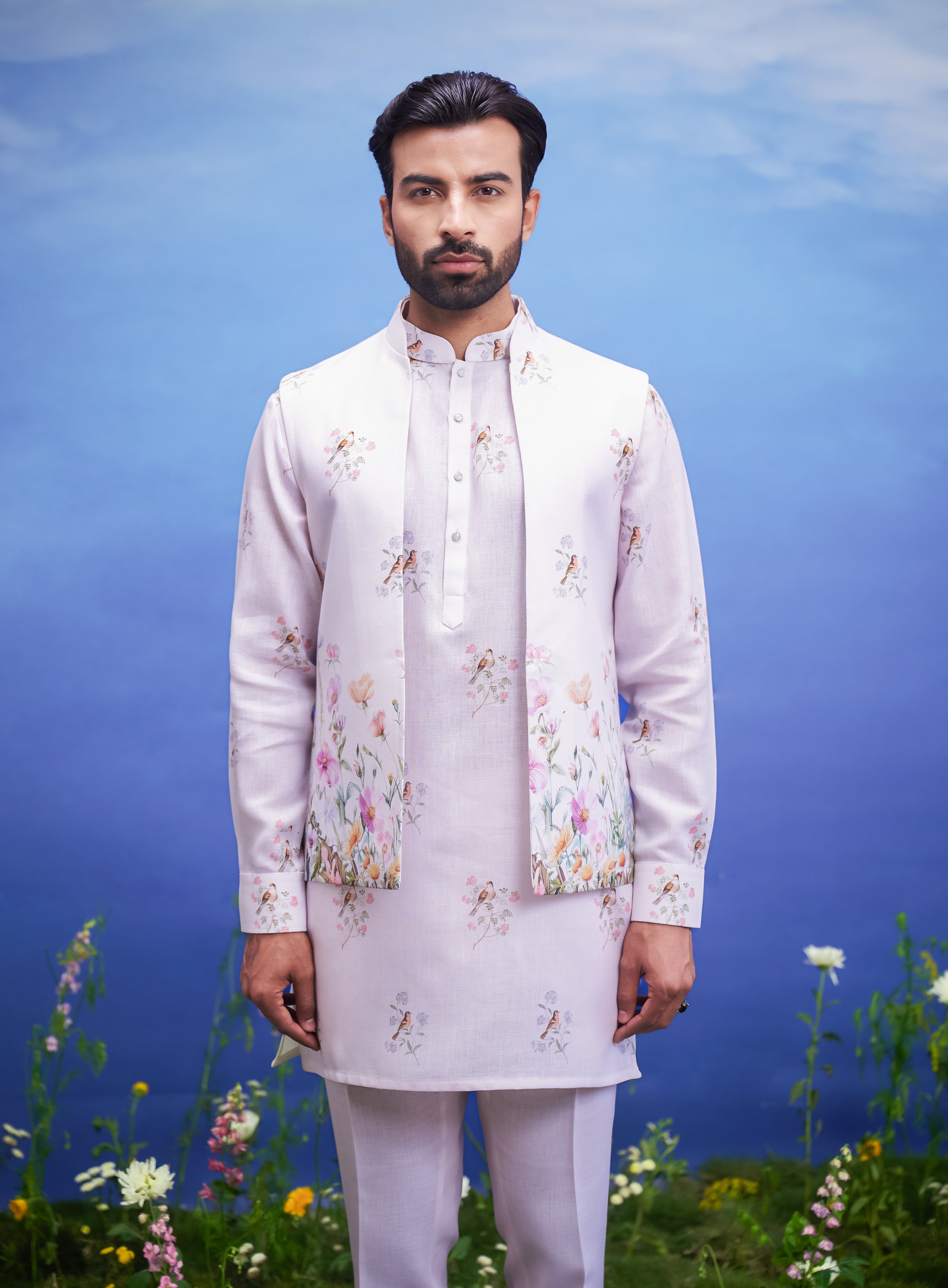 A pink kurta jacket set with a front open design, featuring a kurta, jacket, and pajama, ideal for men's ethnic wear.