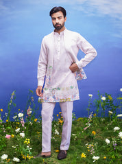 Men's pink kurta jacket set featuring a linen blend kurta, jacket, pajama, and pin.