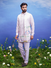 A pink kurta jacket set, featuring a kurta, jacket, and pajama, ideal for men's ethnic wear.
