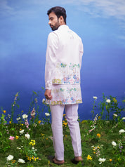 A pink kurta jacket set, featuring a kurta, jacket, and pajama, ideal for men's ethnic wear.